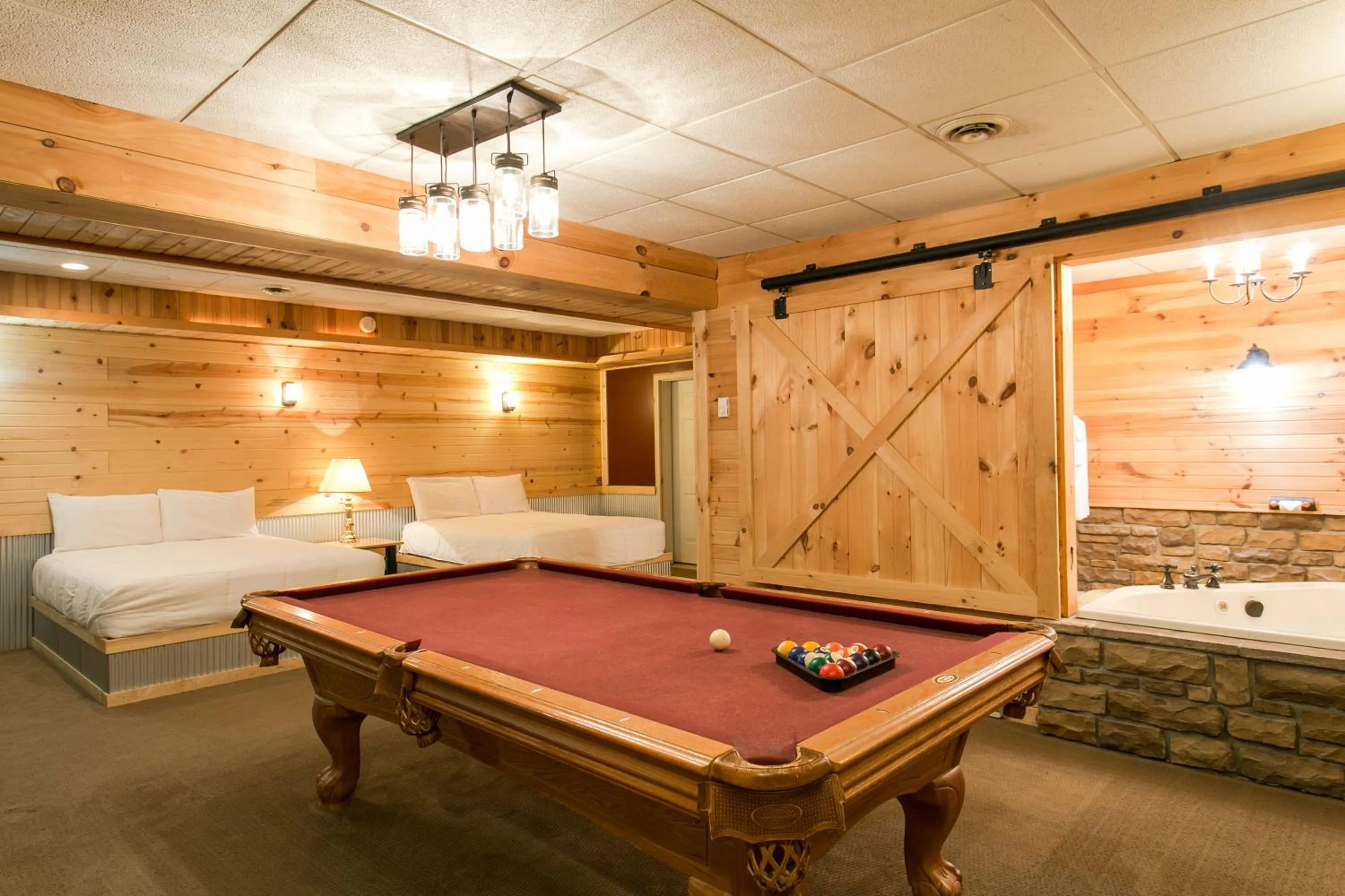 Billiard, Bed in Blue Jays Nest Cabin by Amish Country Lodging