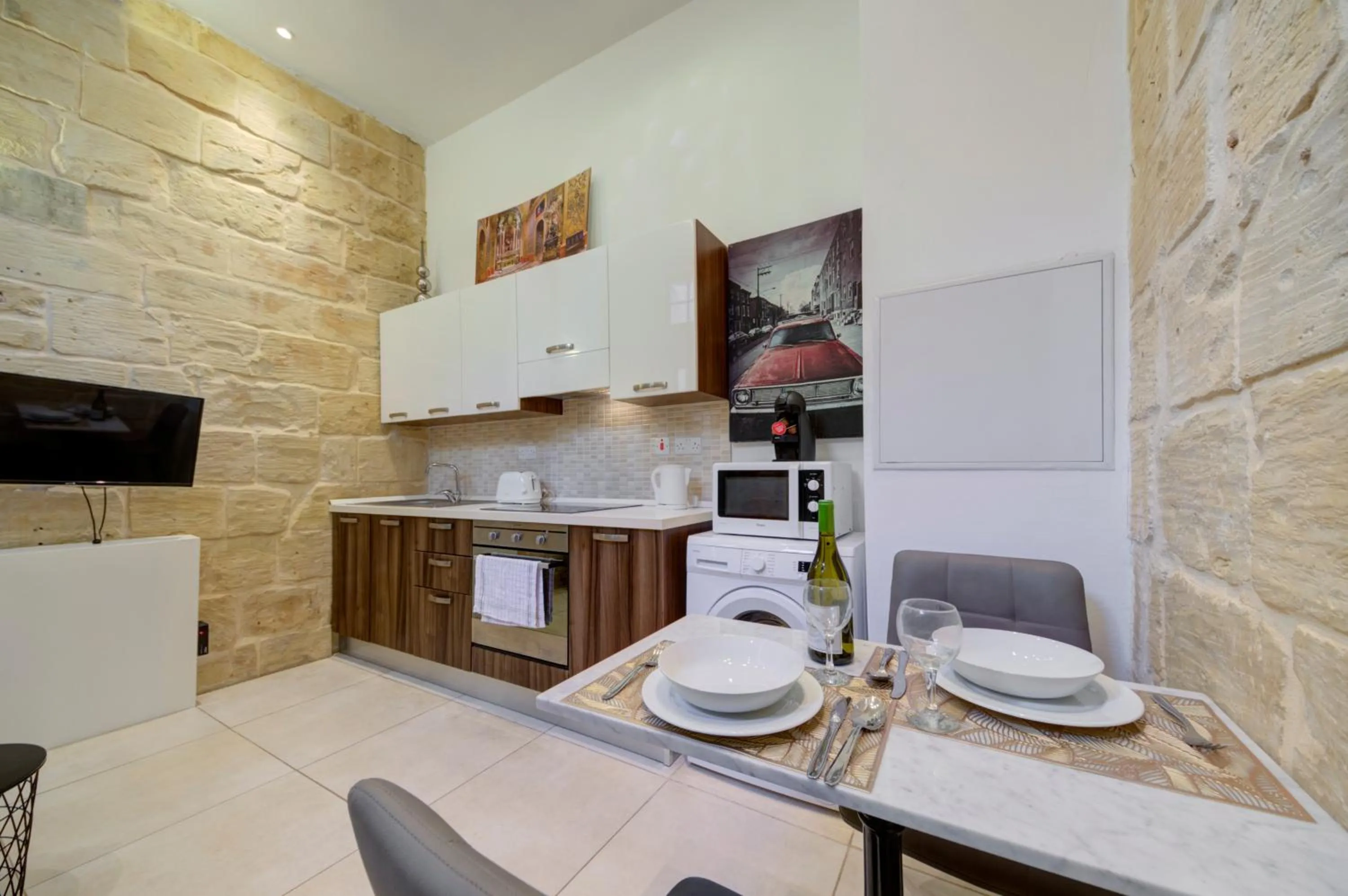 Kitchen or kitchenette in Tritoni Harbour suites - Valletta