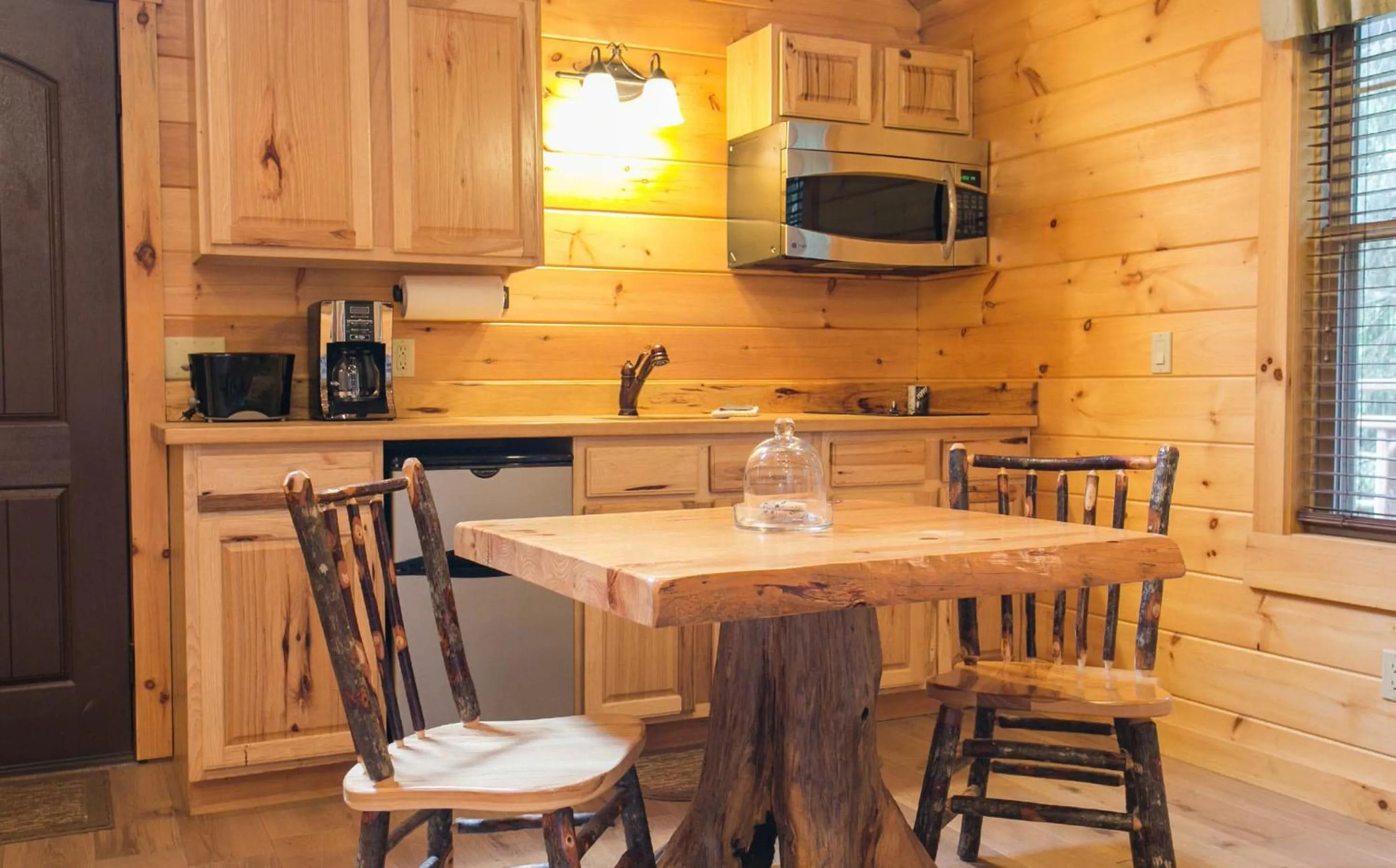 Kitchen or kitchenette in Lofty Willows Treehouse by Amish Country Lodging