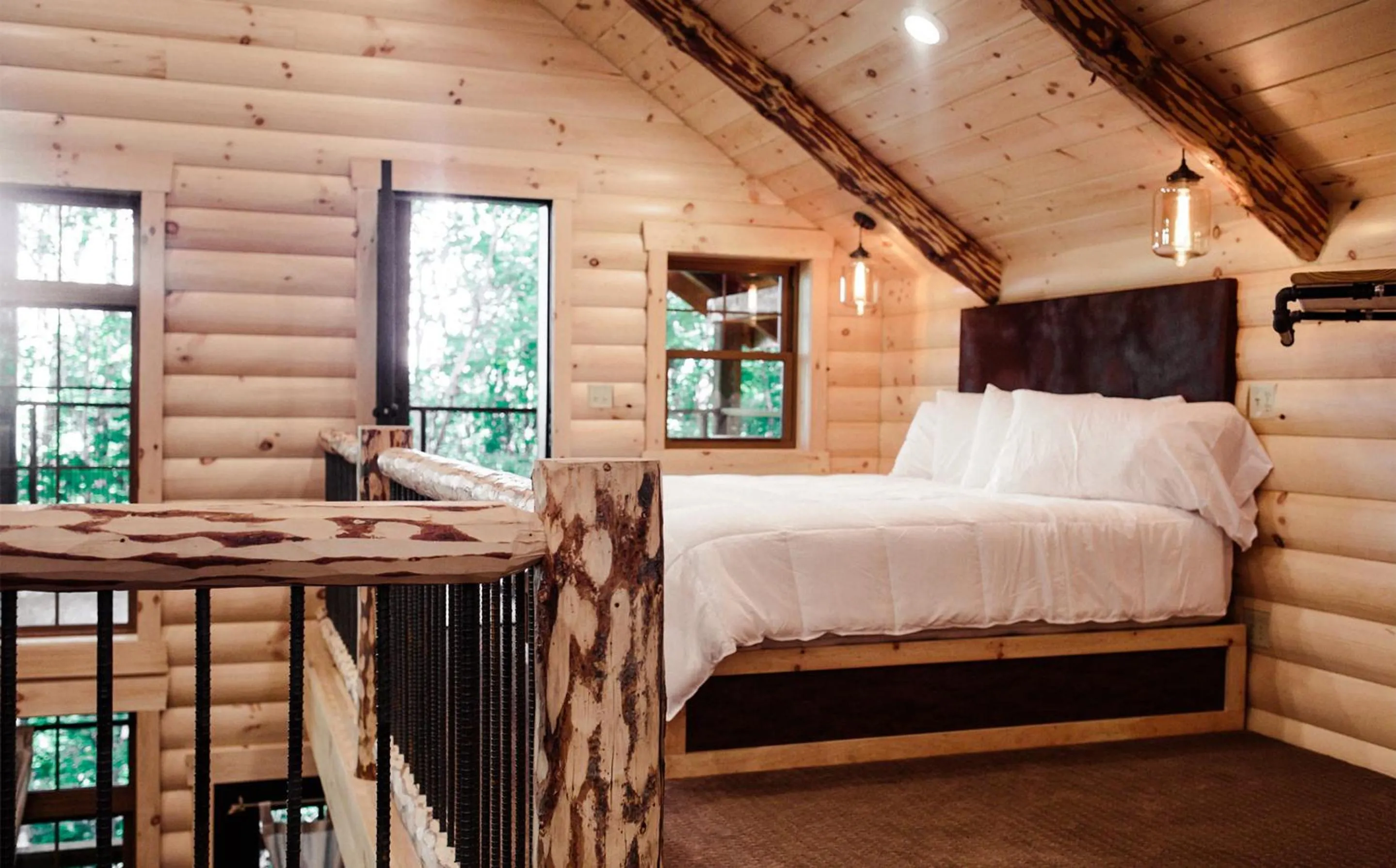 Bed in Treehouse #1 by Amish Country Lodging