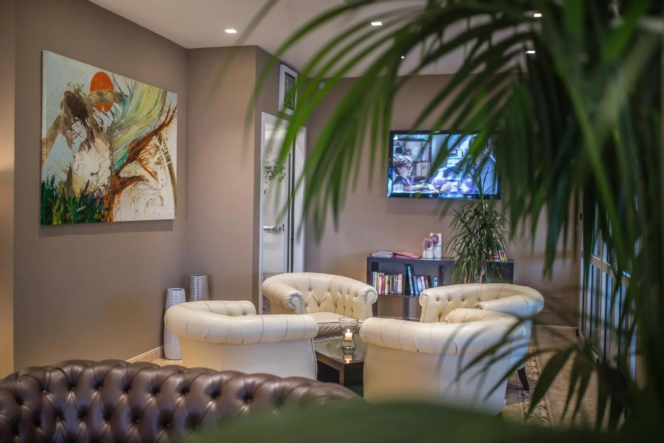 Communal lounge/ TV room in Hotel Excelsior