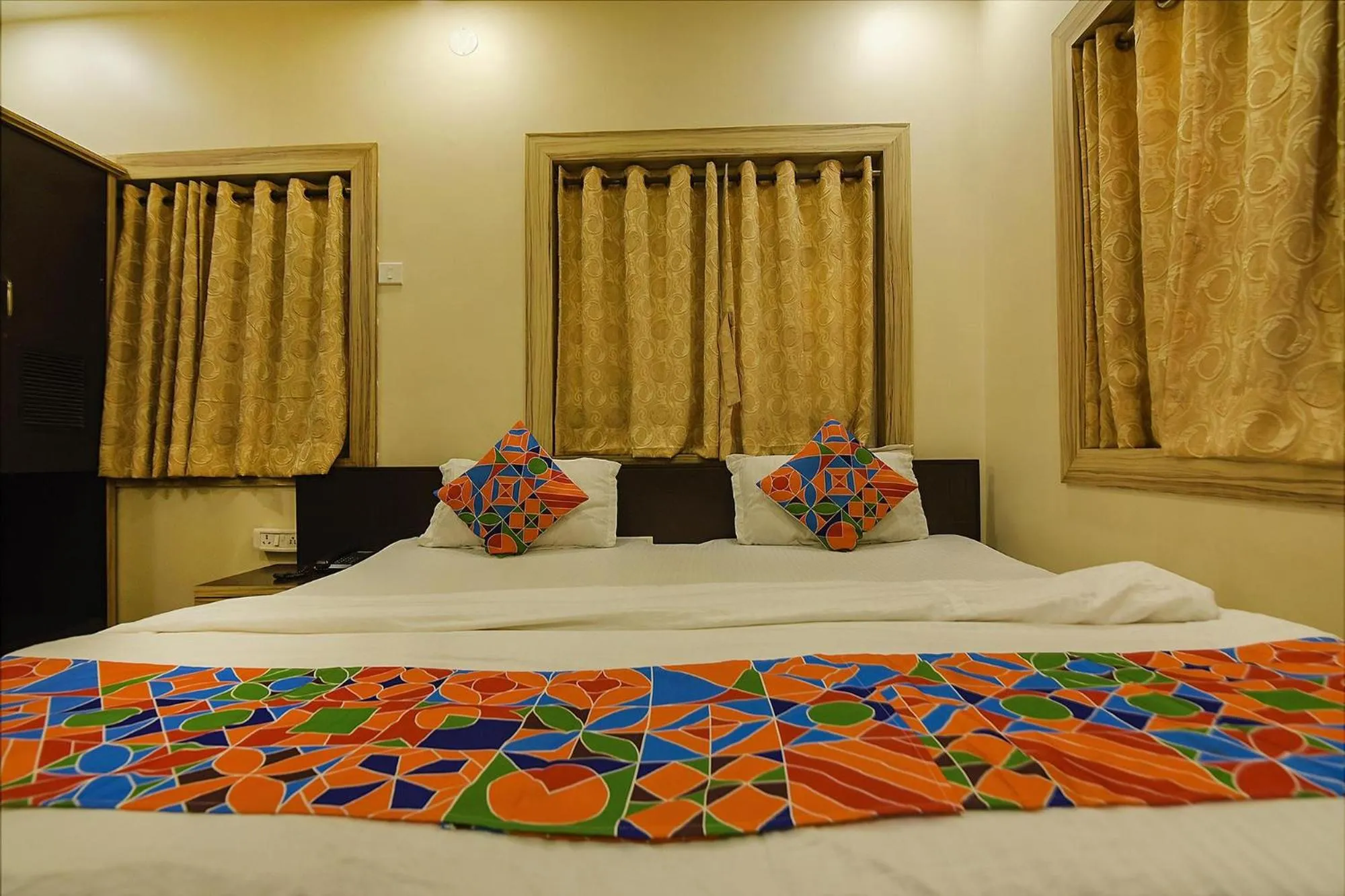 Bed in FabHotel Shivalya