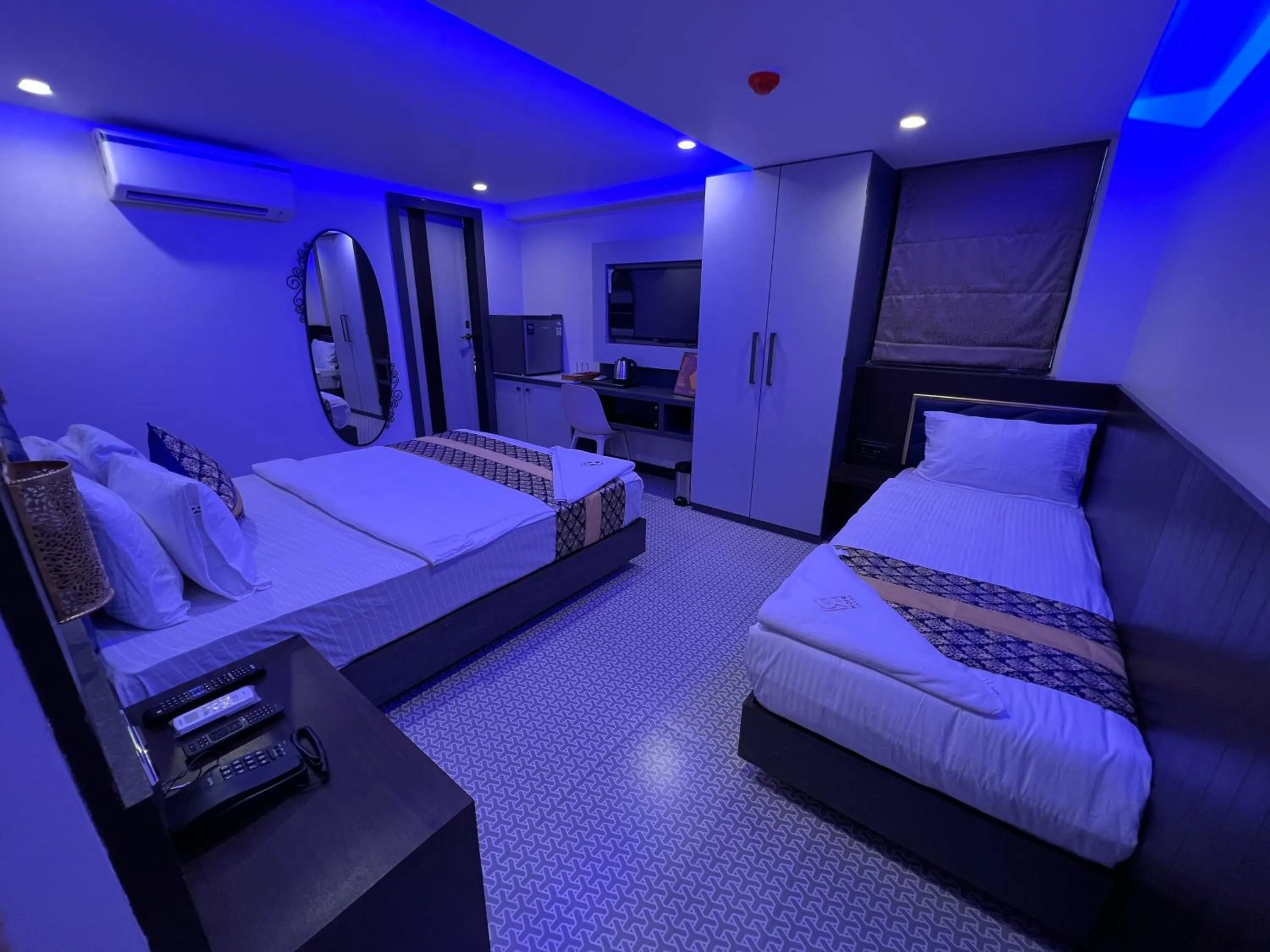 Bed in Rich Hotel Mumbai