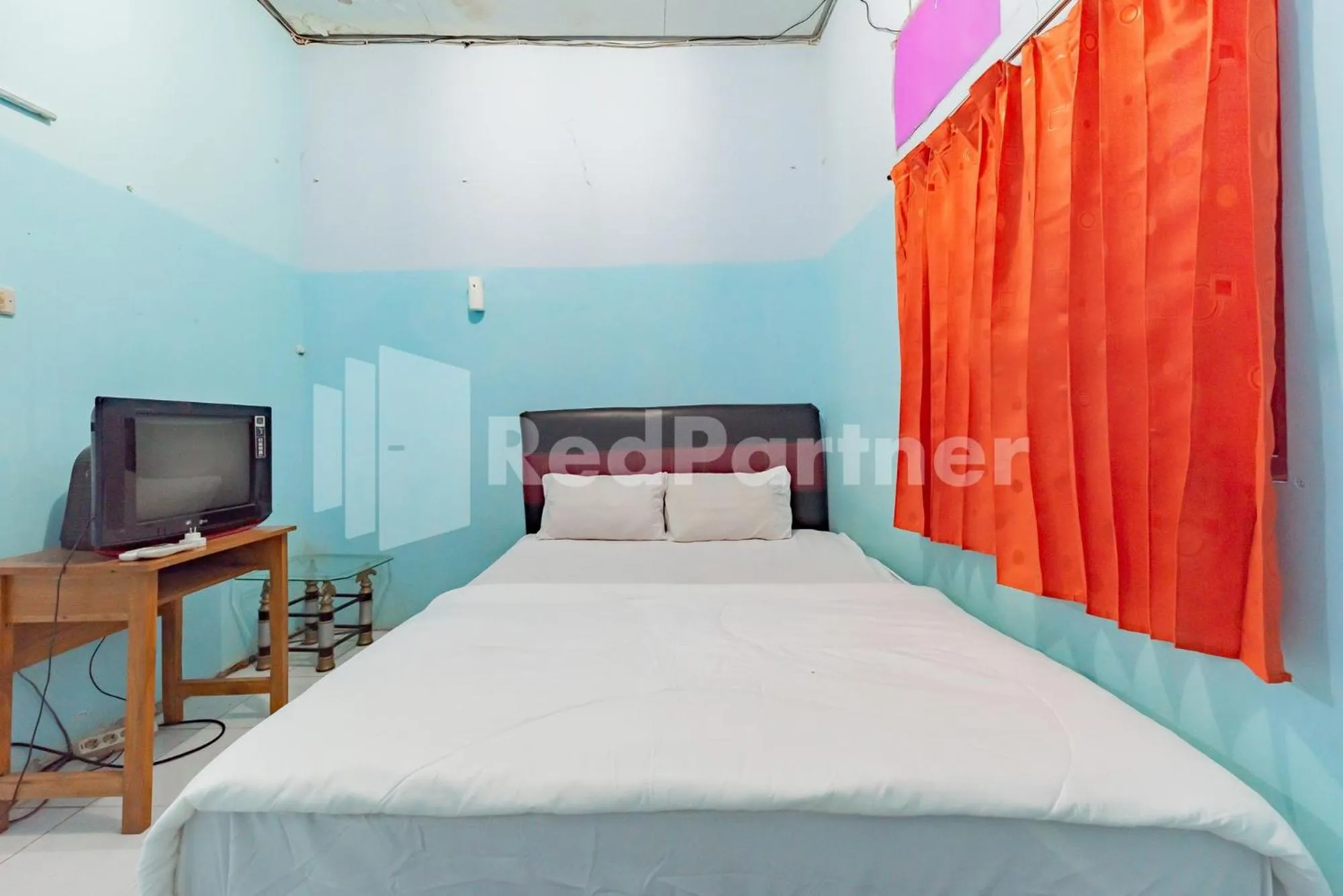 Bed in Ana Guest House Syariah Mitra RedDoorz