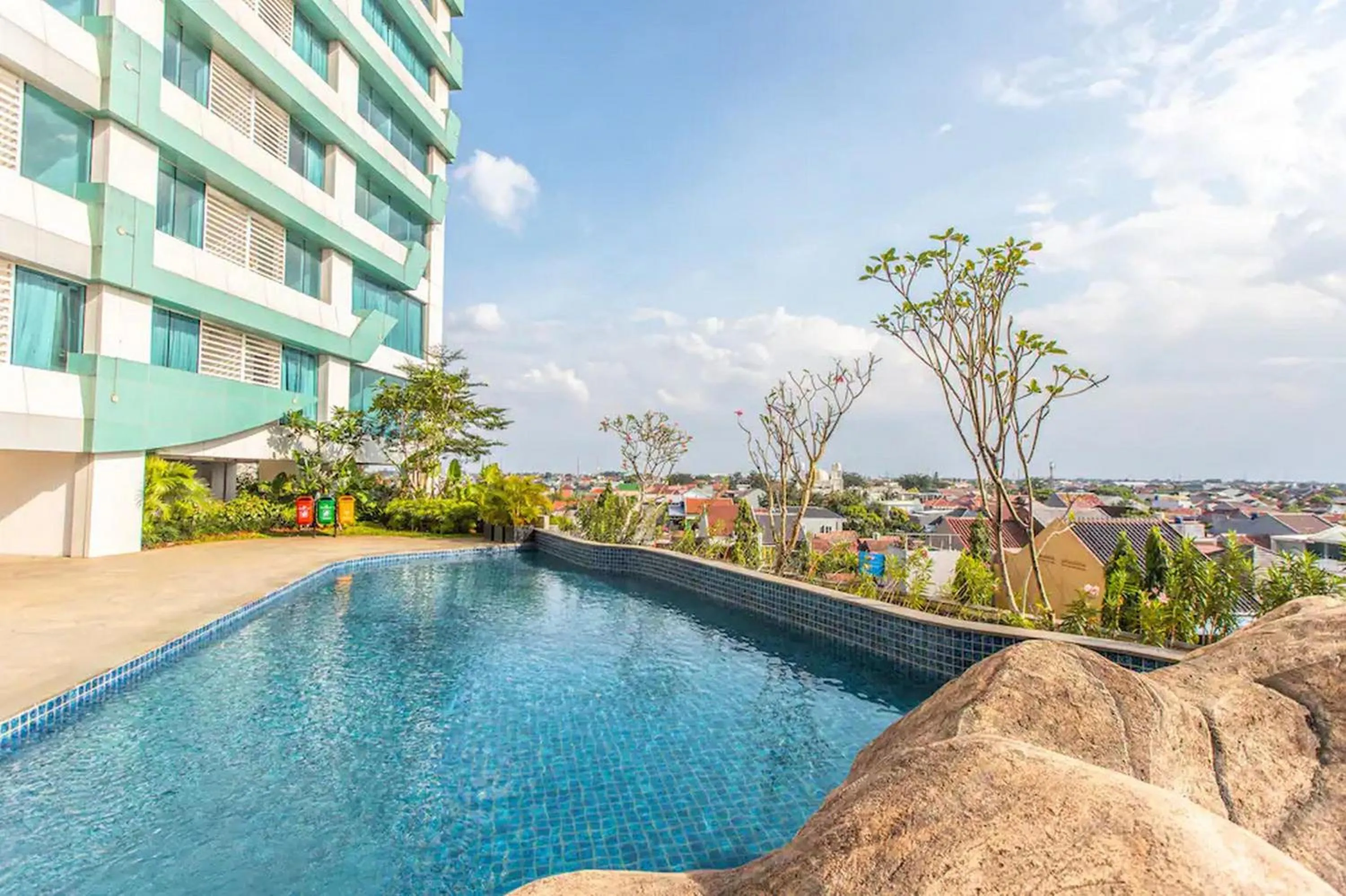 Swimming pool in RedLiving Apartemen Grand Kamala Lagoon - Pekayon Tower Barclay North