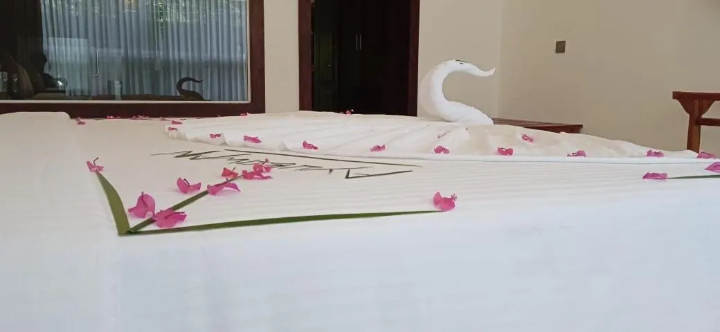 Bed in Sigiriya Cashew Palace Resort