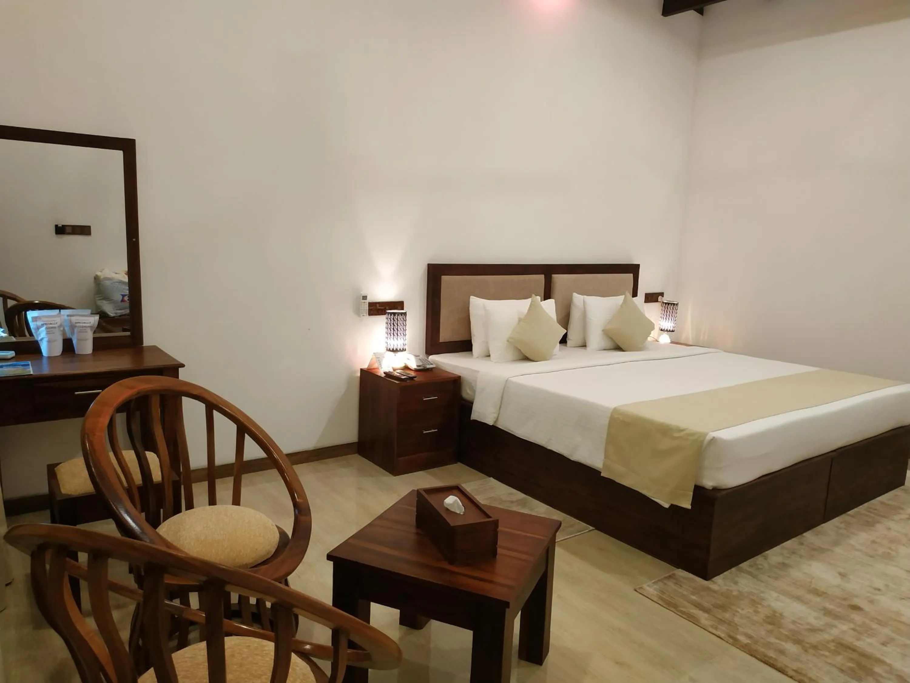 Bed in Sigiriya Cashew Palace Resort