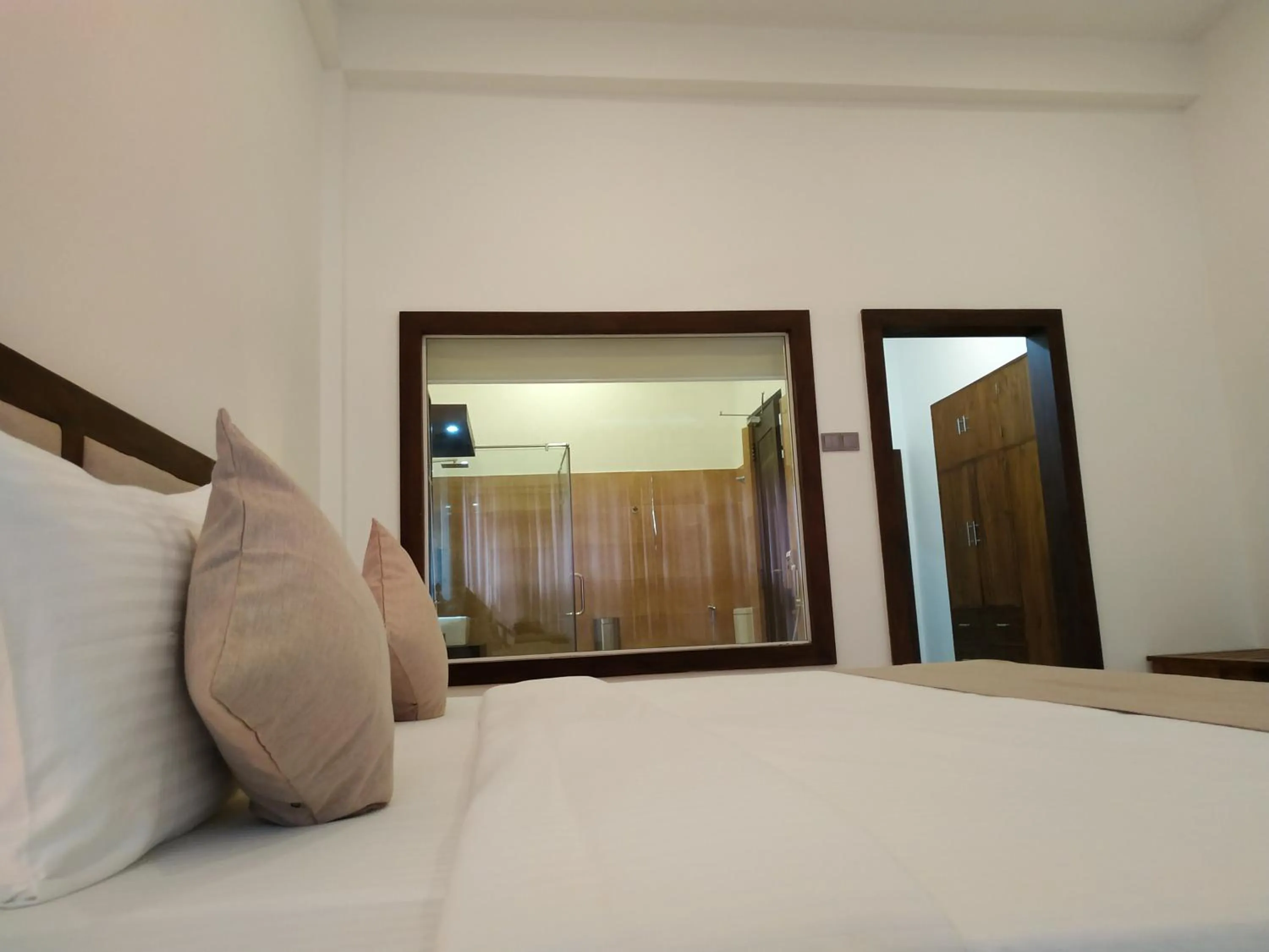 Bed in Sigiriya Cashew Palace Resort