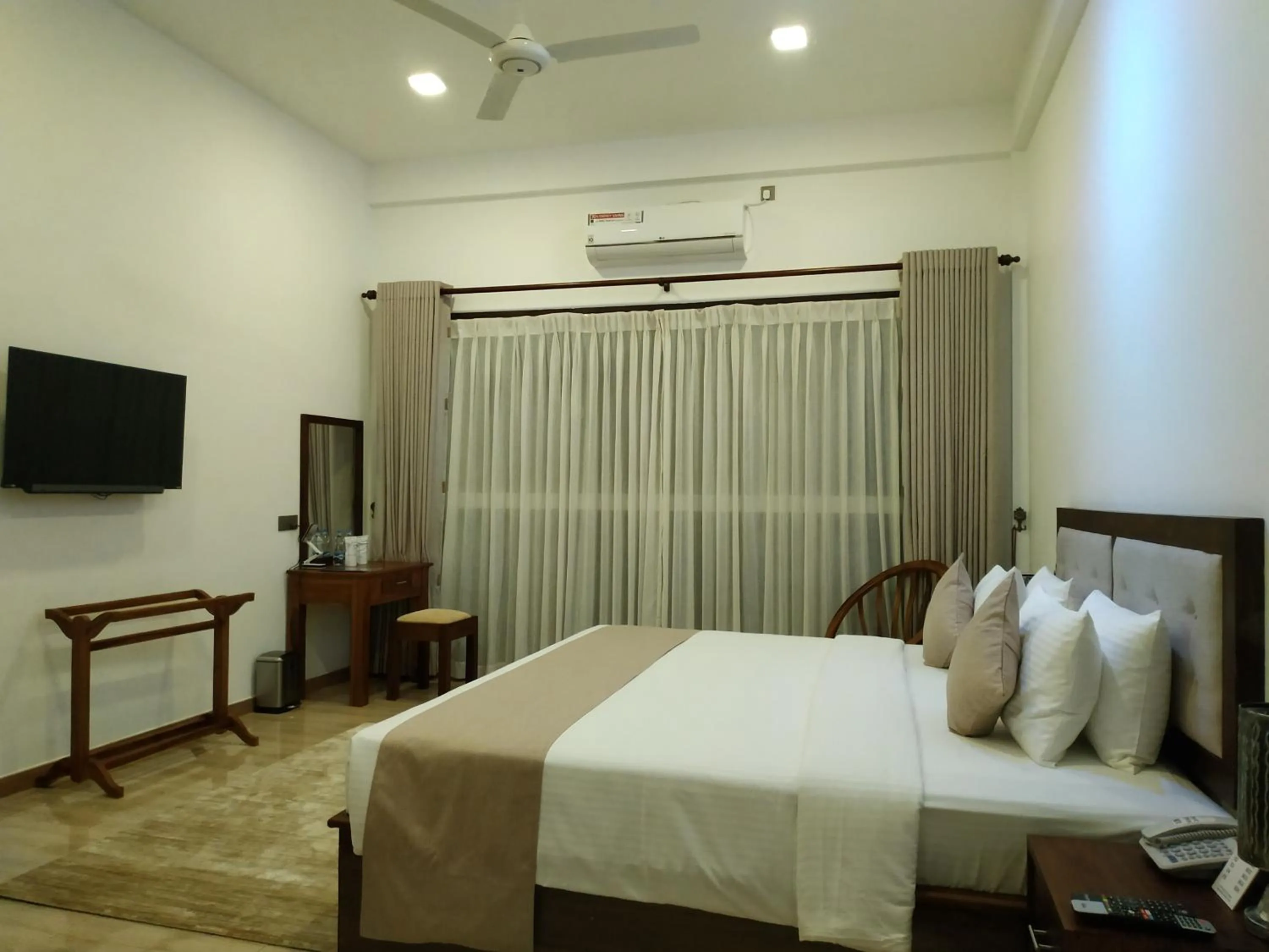 Bed in Sigiriya Cashew Palace Resort