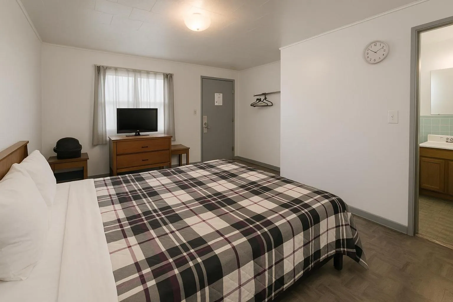 Bedroom, Bed in OYO Sandman Inn