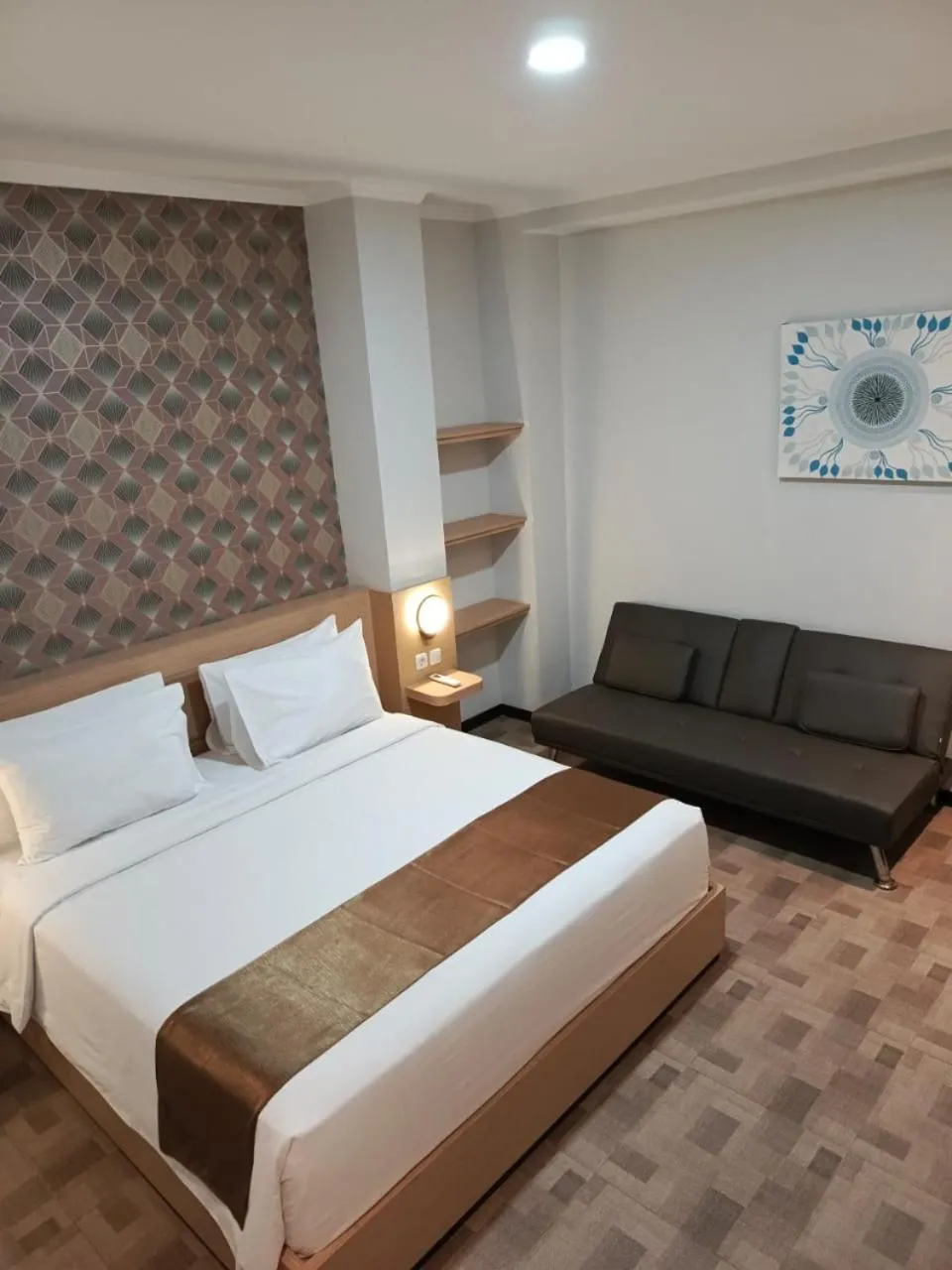 Bed in Grand Plaza Boutique Hotel