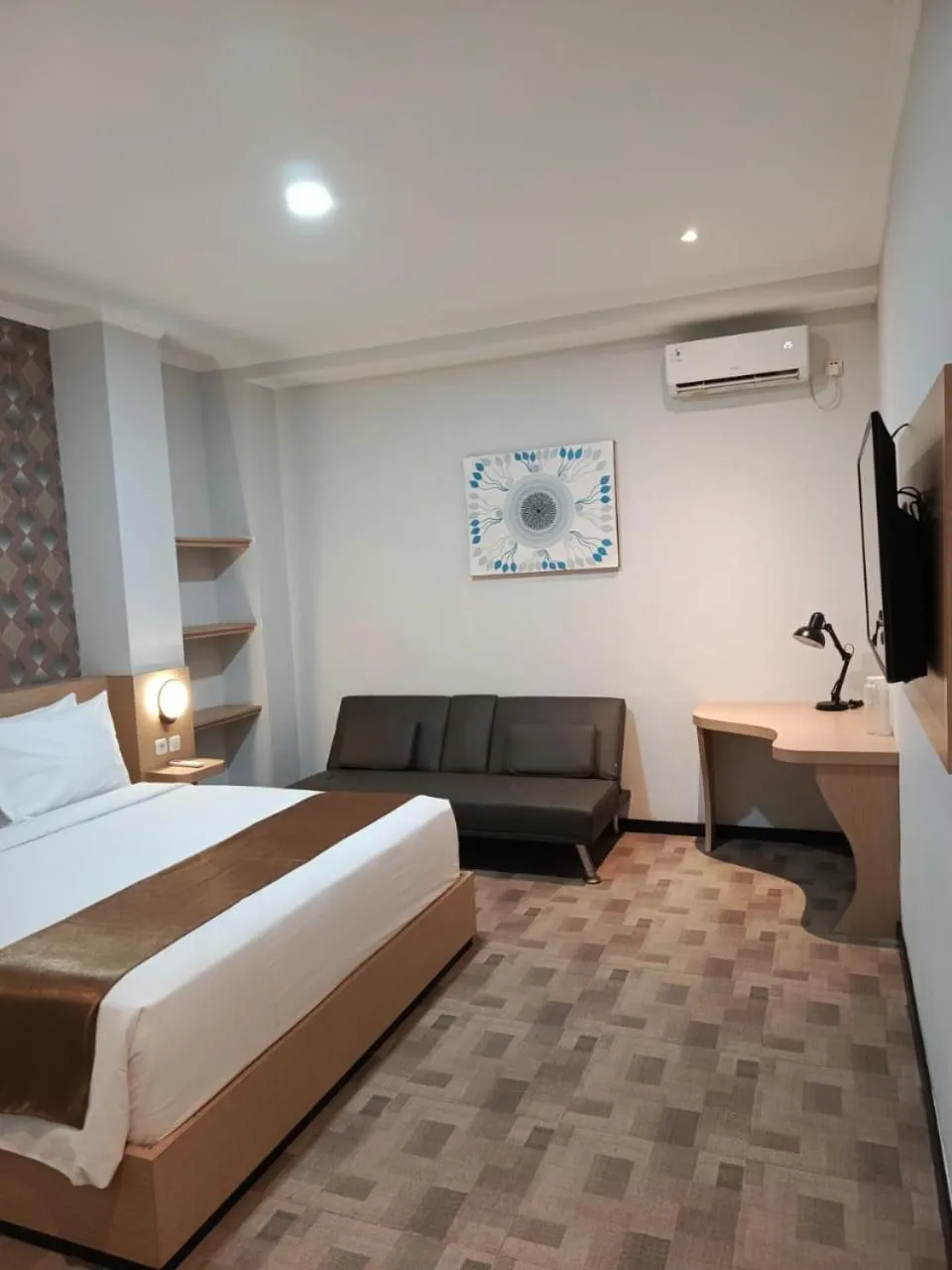 Bed in Grand Plaza Boutique Hotel