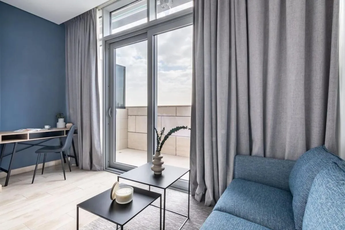 Photo of the whole room in Silkhaus comfy DIFC studio with Burj Khalifa view