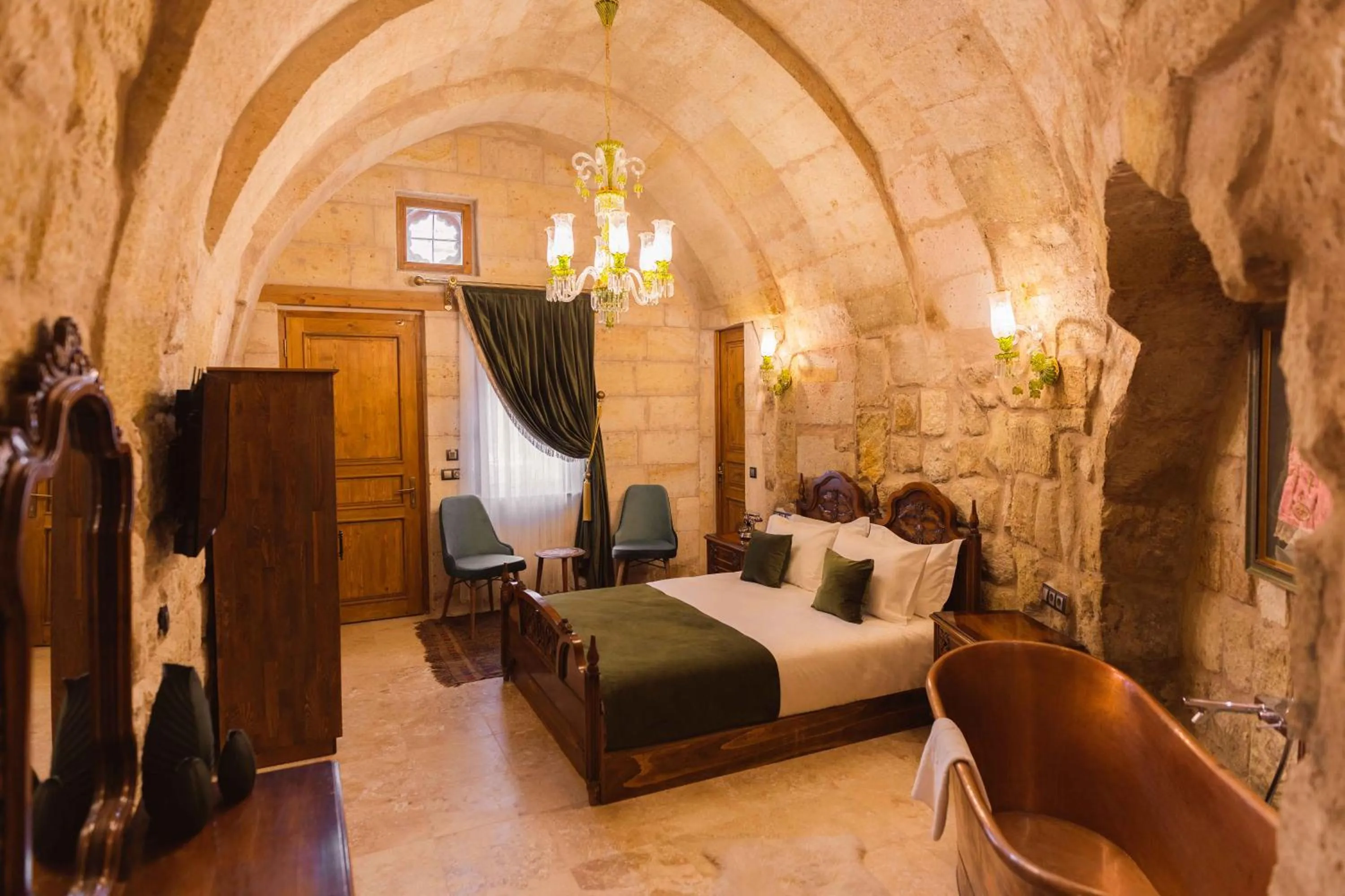 Living room, Bed in Solo Cave Suites