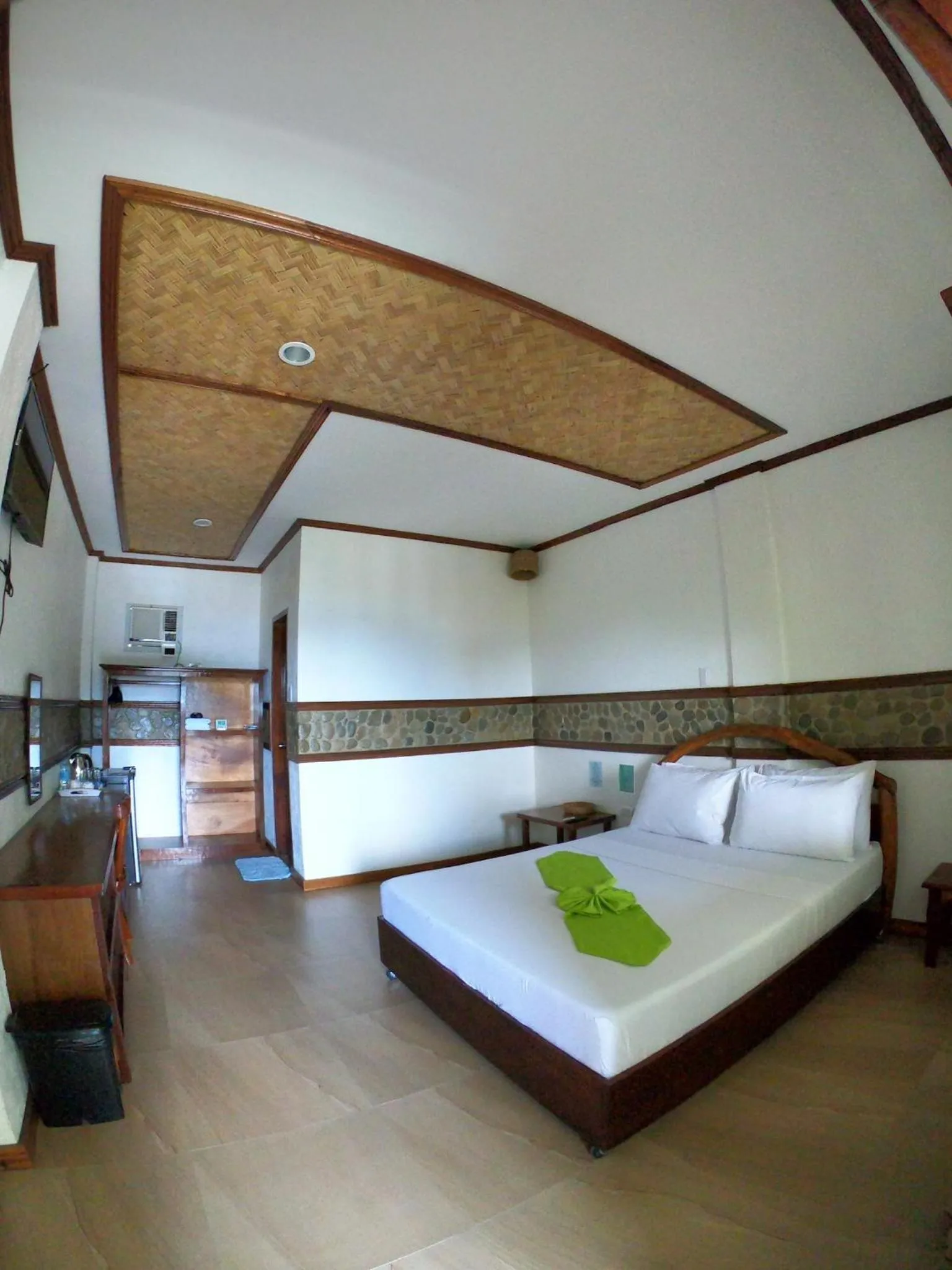 Bed in El Nido Viewdeck Cottages