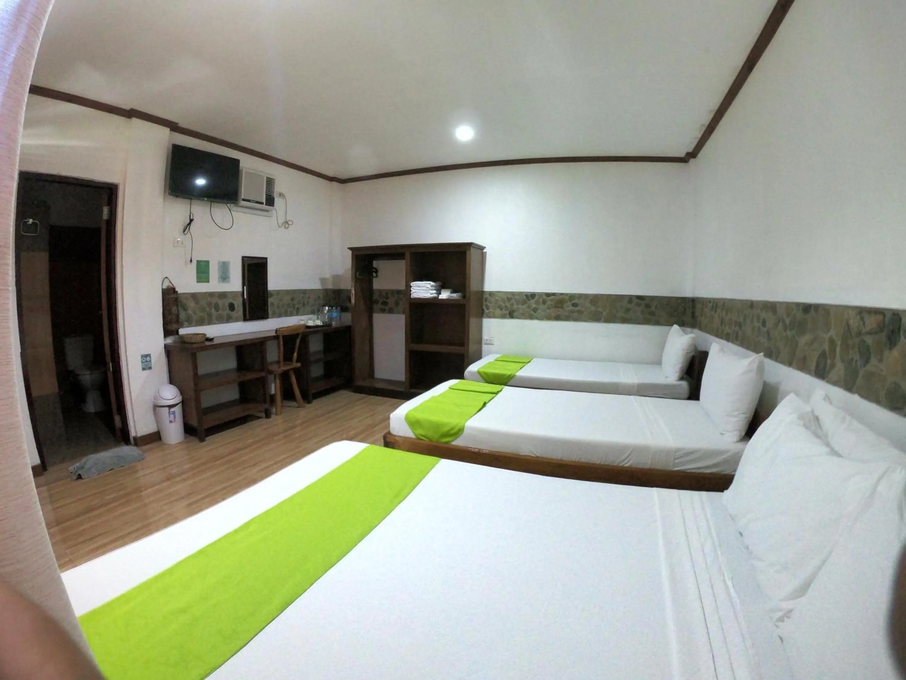 Bed in El Nido Viewdeck Cottages