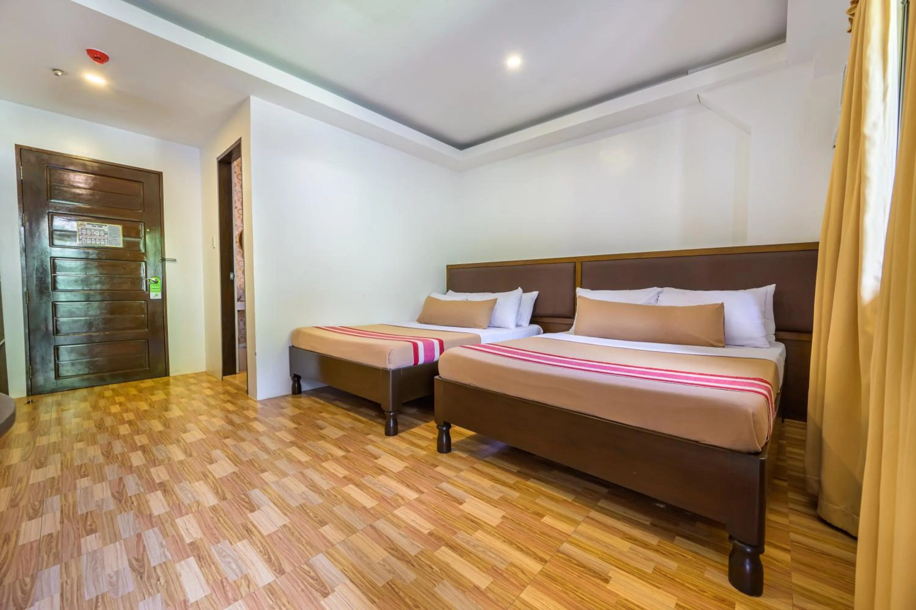 Bed in Jurias Garden Hotel