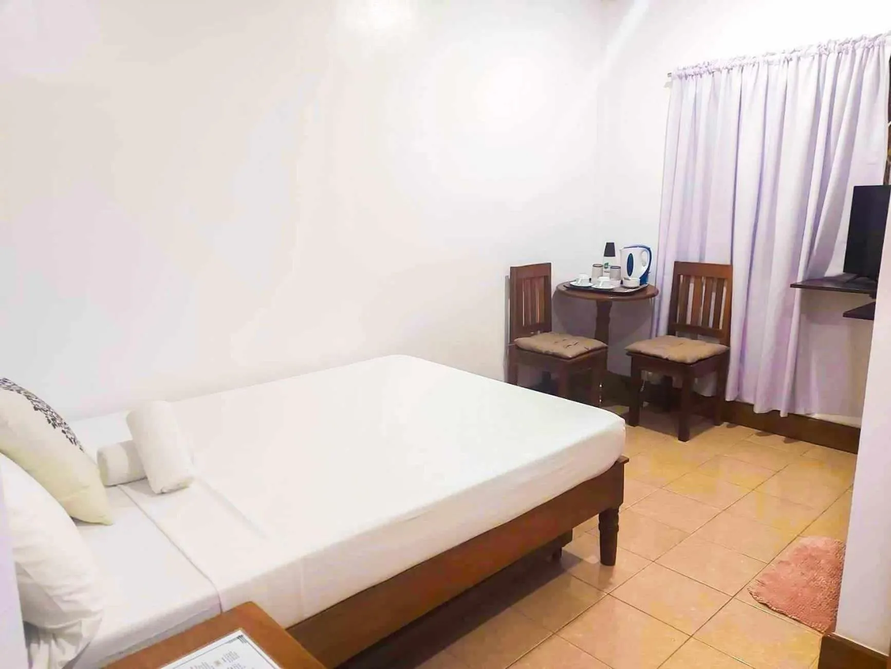 Bed in Jurias Garden Hotel