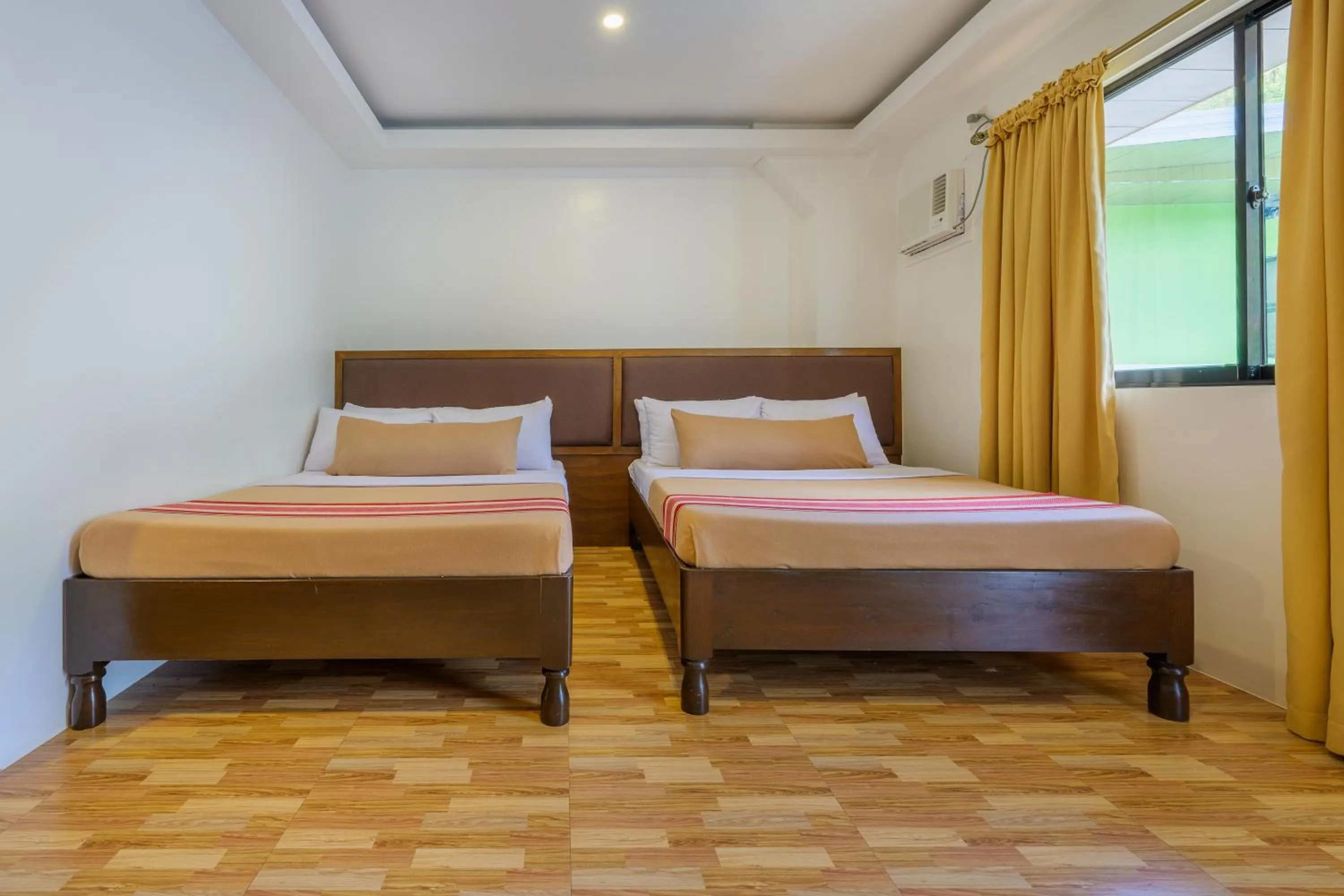 Bed in Jurias Garden Hotel