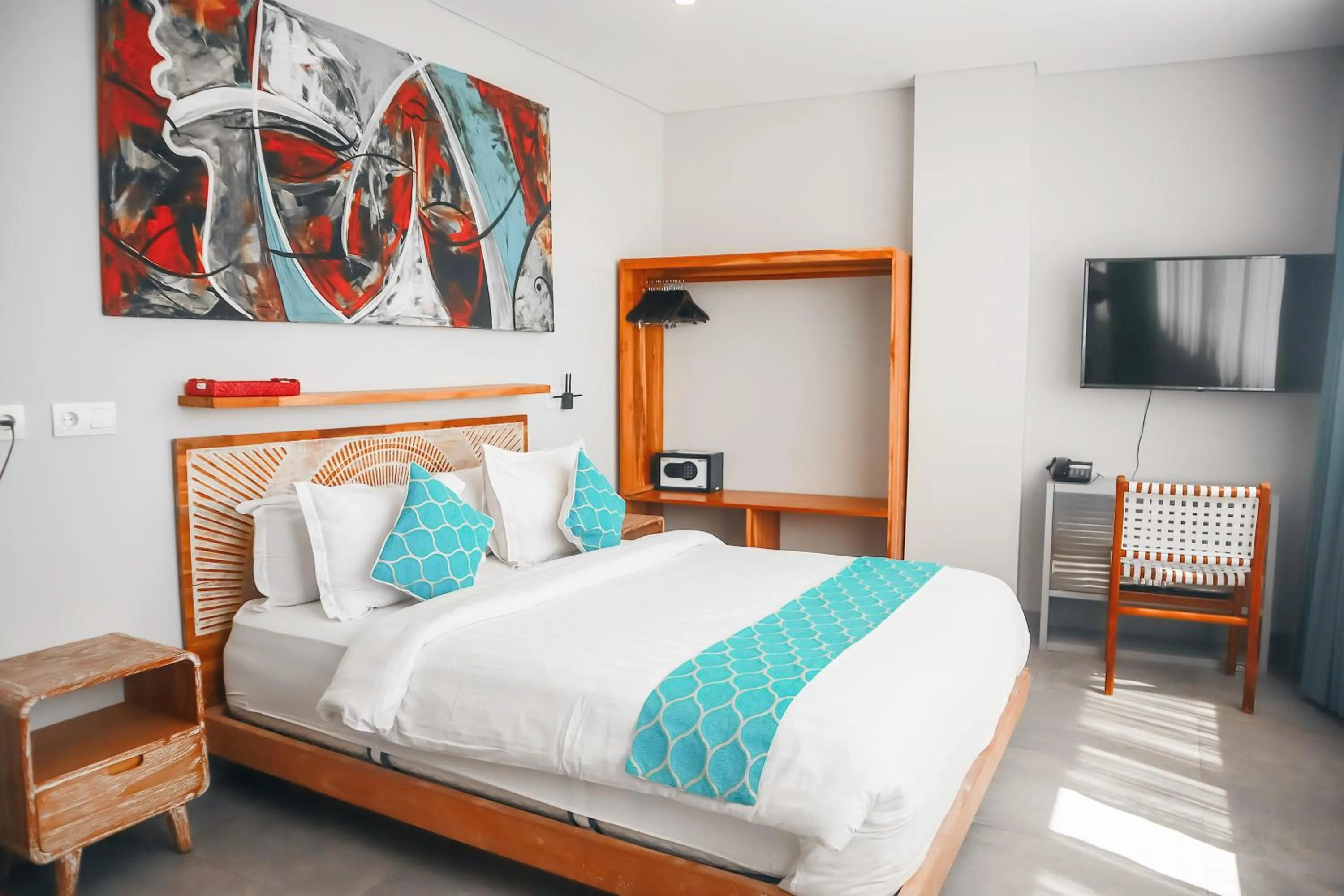 Communal lounge/ TV room, Bed in Harbour Komodo Hotel