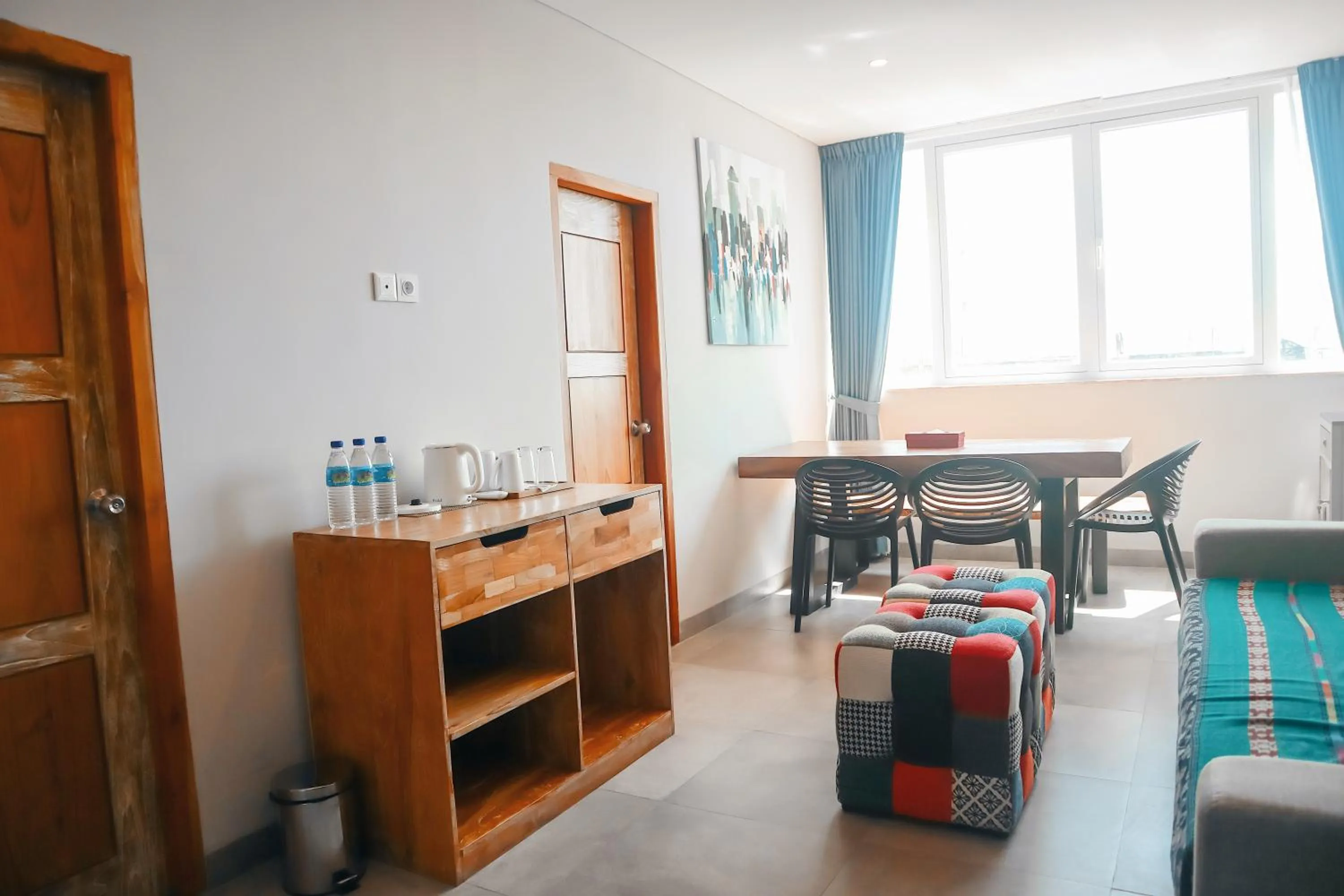 Communal lounge/ TV room in Harbour Komodo Hotel