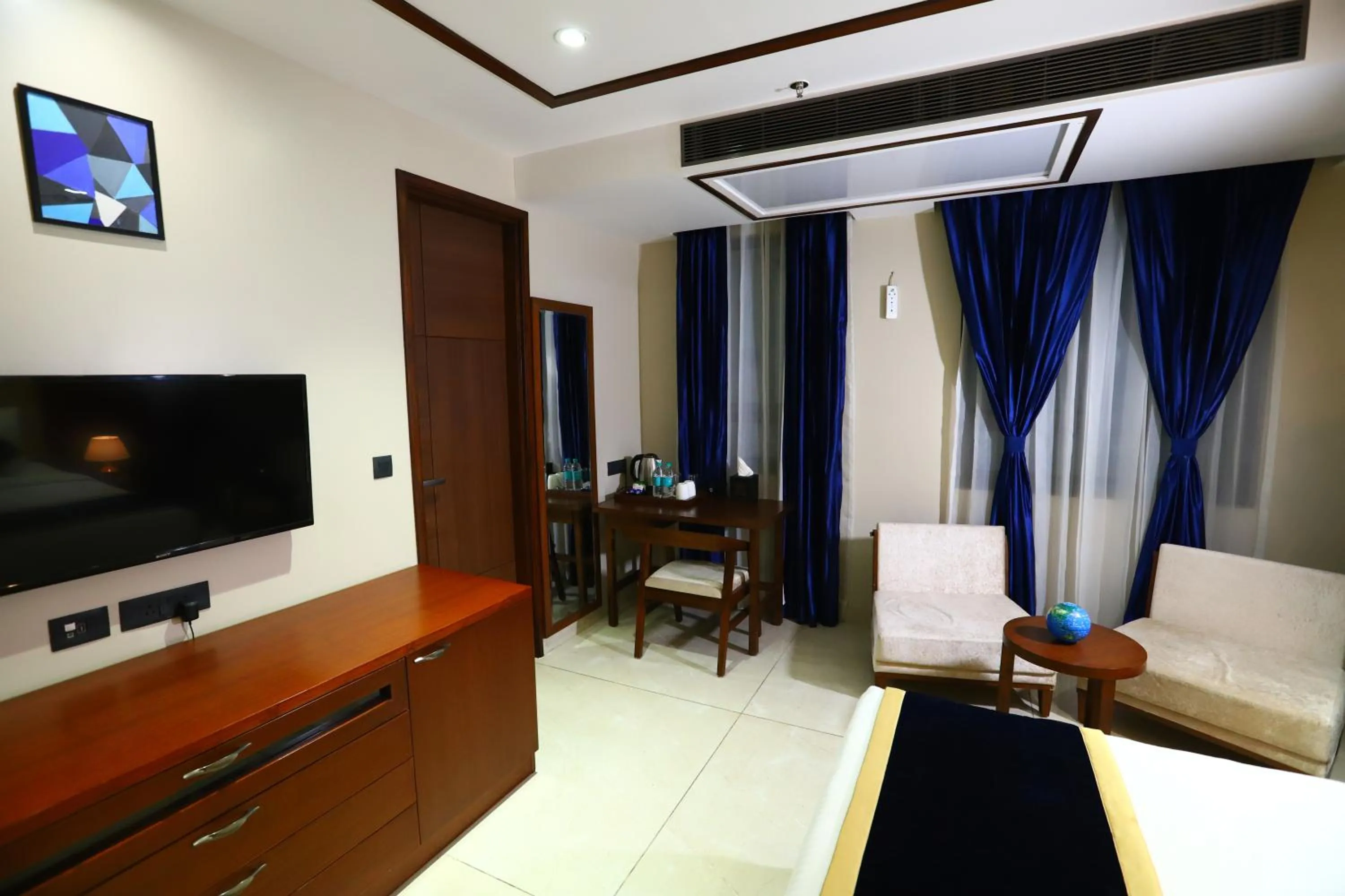 TV and multimedia, Bed in Sanca International Hotel in Patel Nagar Delhi