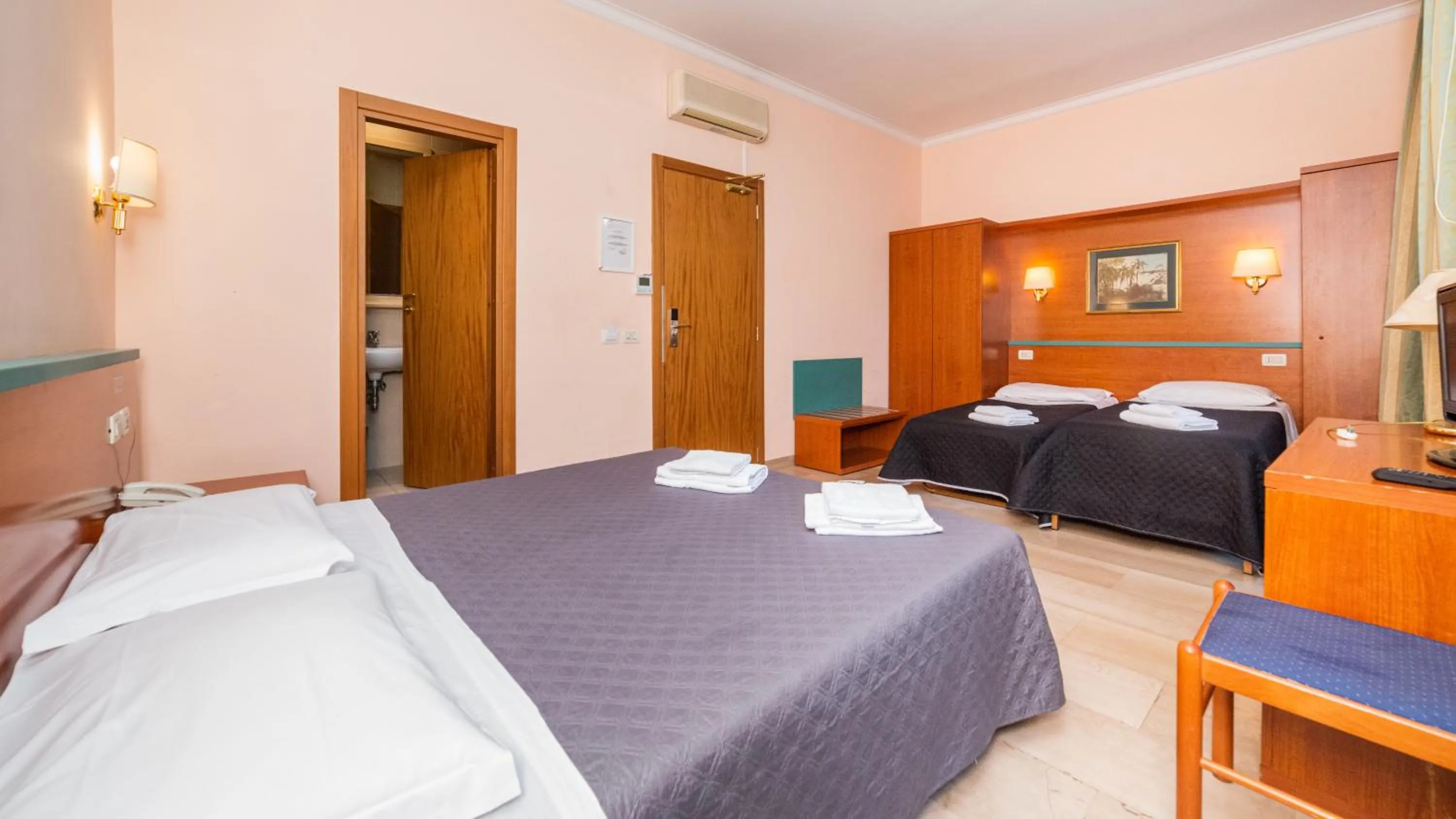 Photo of the whole room, Bed in Hotel Center 1