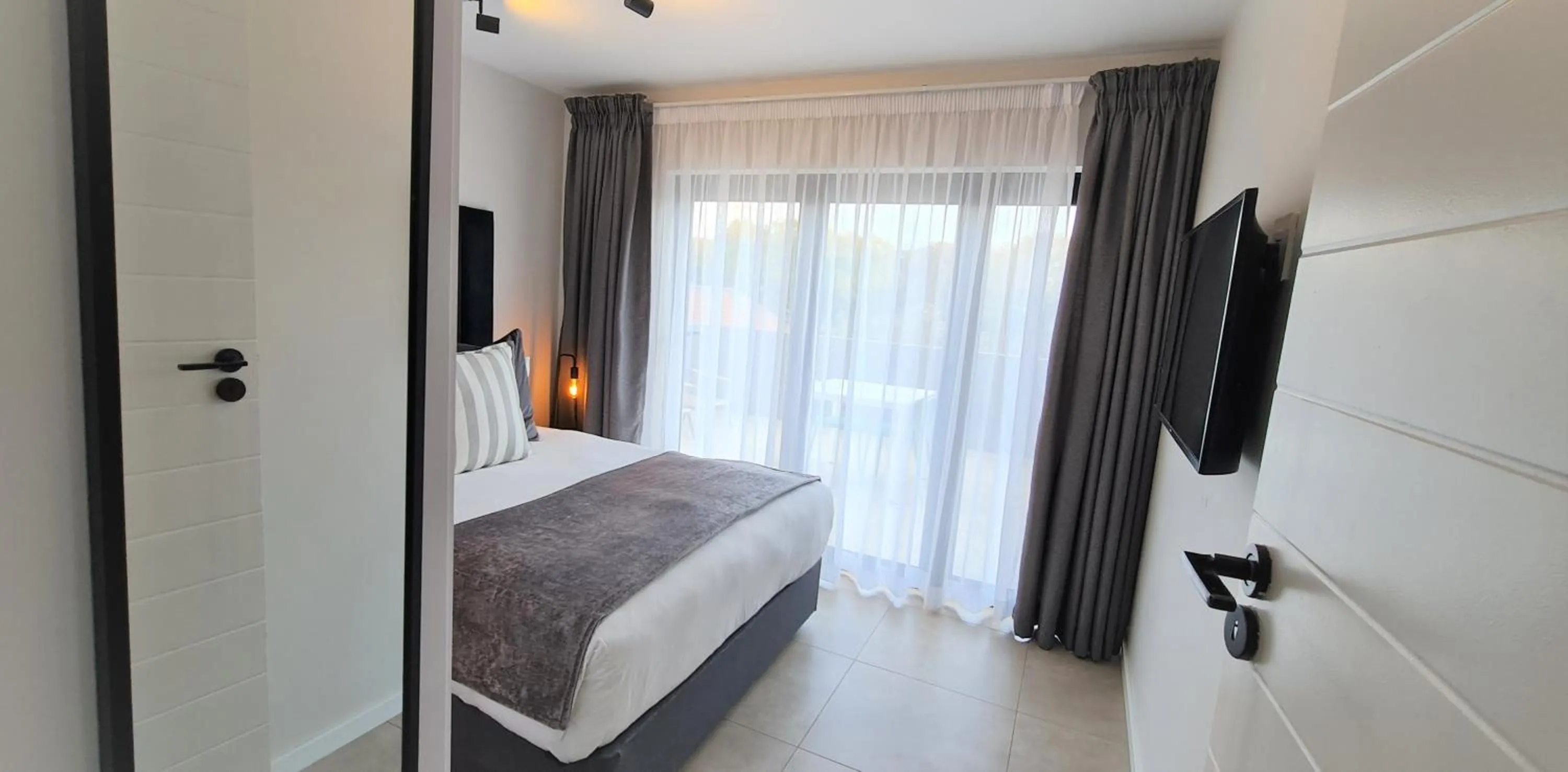 Bed in MINT Apartments Greenside