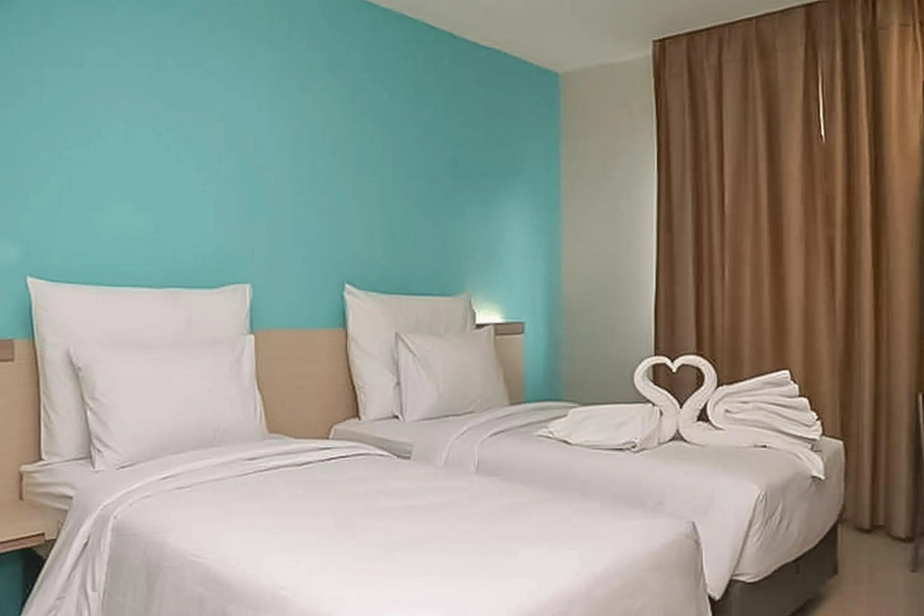 Bed in Hotel Mutiara Padang Sidimpuan Mitra RedDoorz