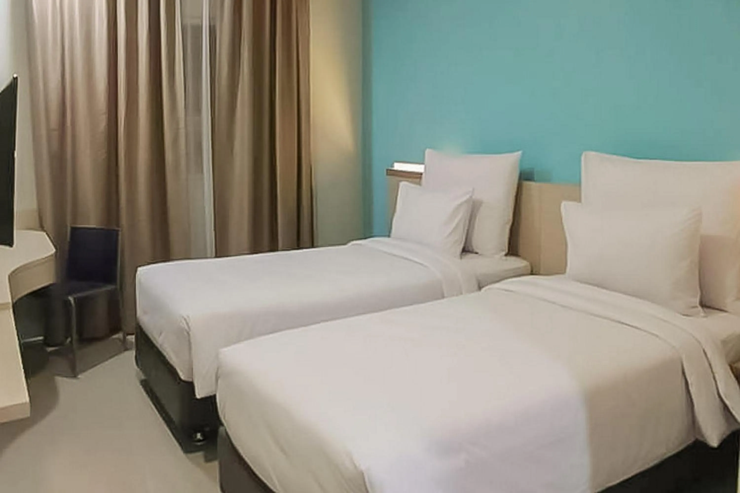 Bed in Hotel Mutiara Padang Sidimpuan Mitra RedDoorz