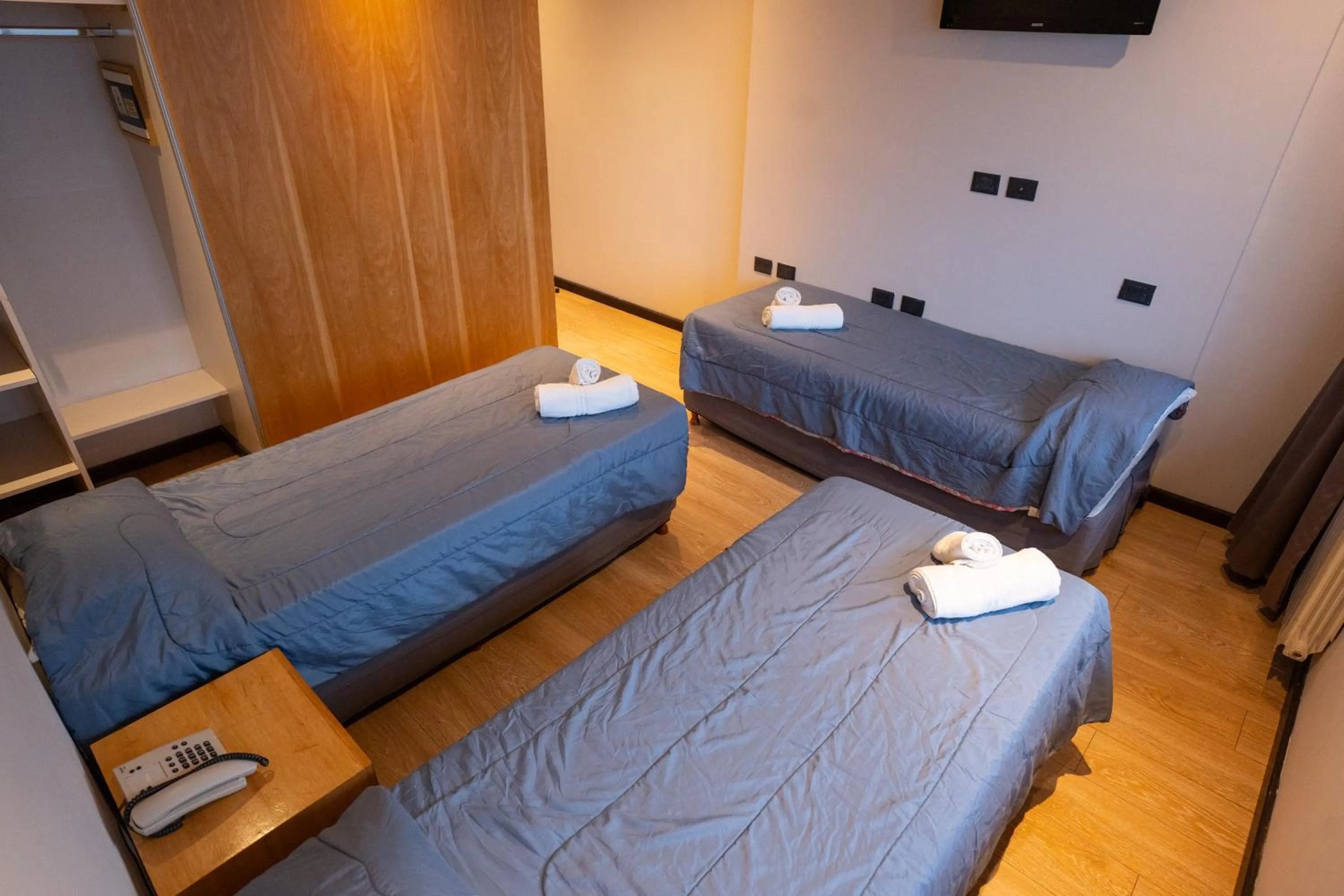 Bed in Hotel Bariloche Suites