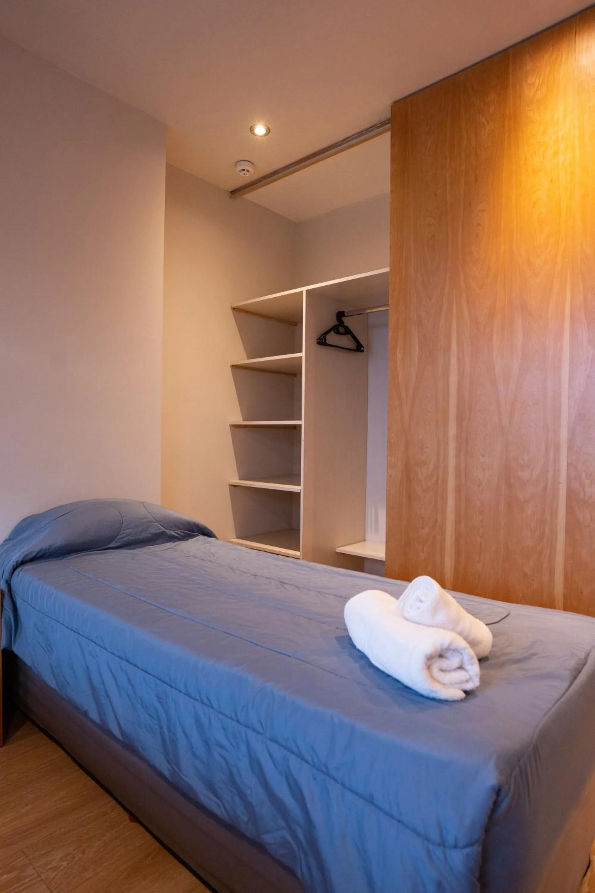 Bed in Hotel Bariloche Suites