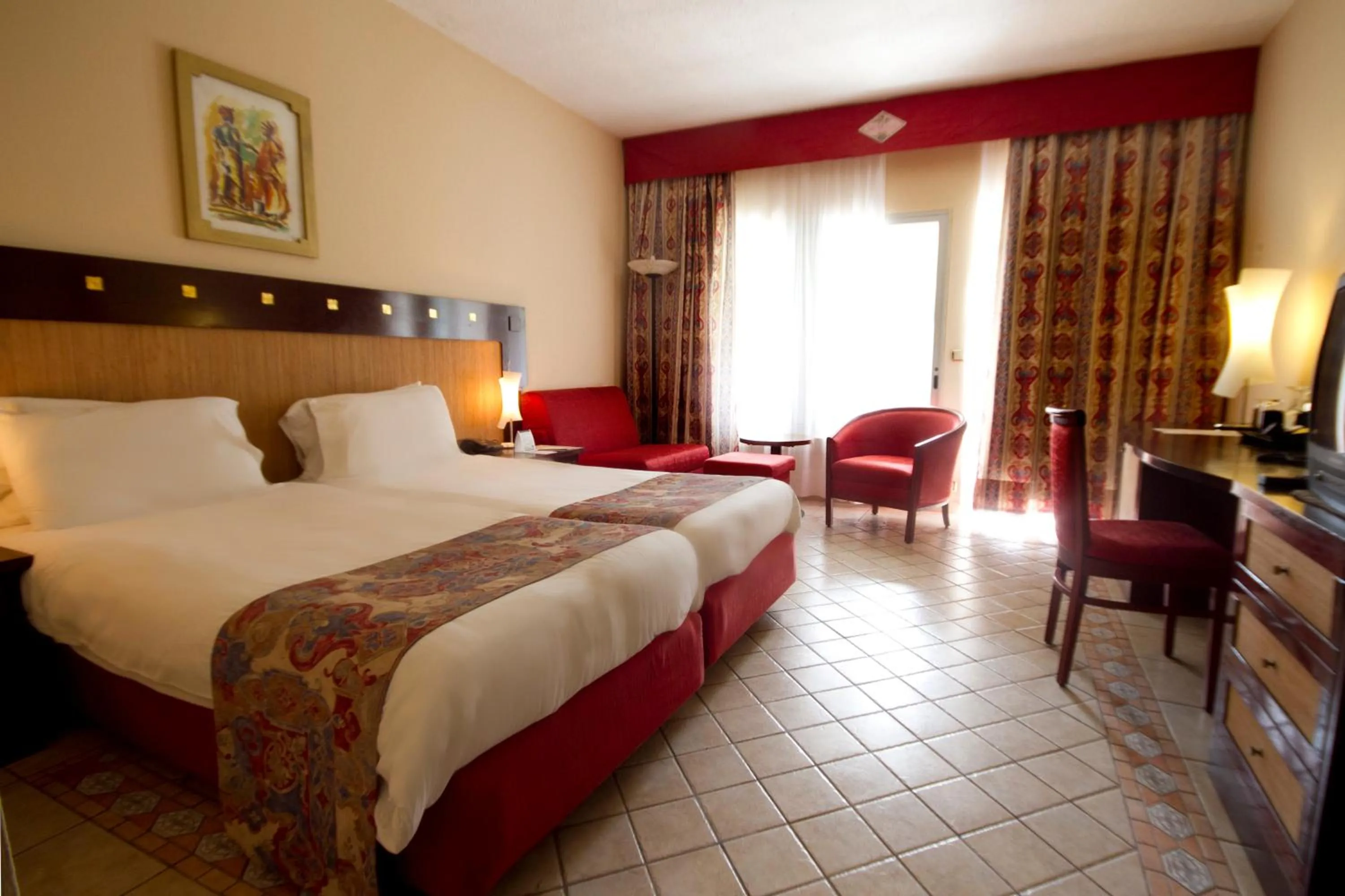 Bed in The Kairaba Beach Hotel