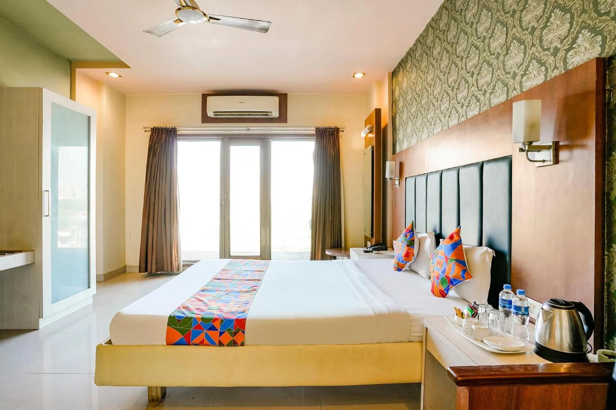 Bed in FabHotel Devanshi Inn