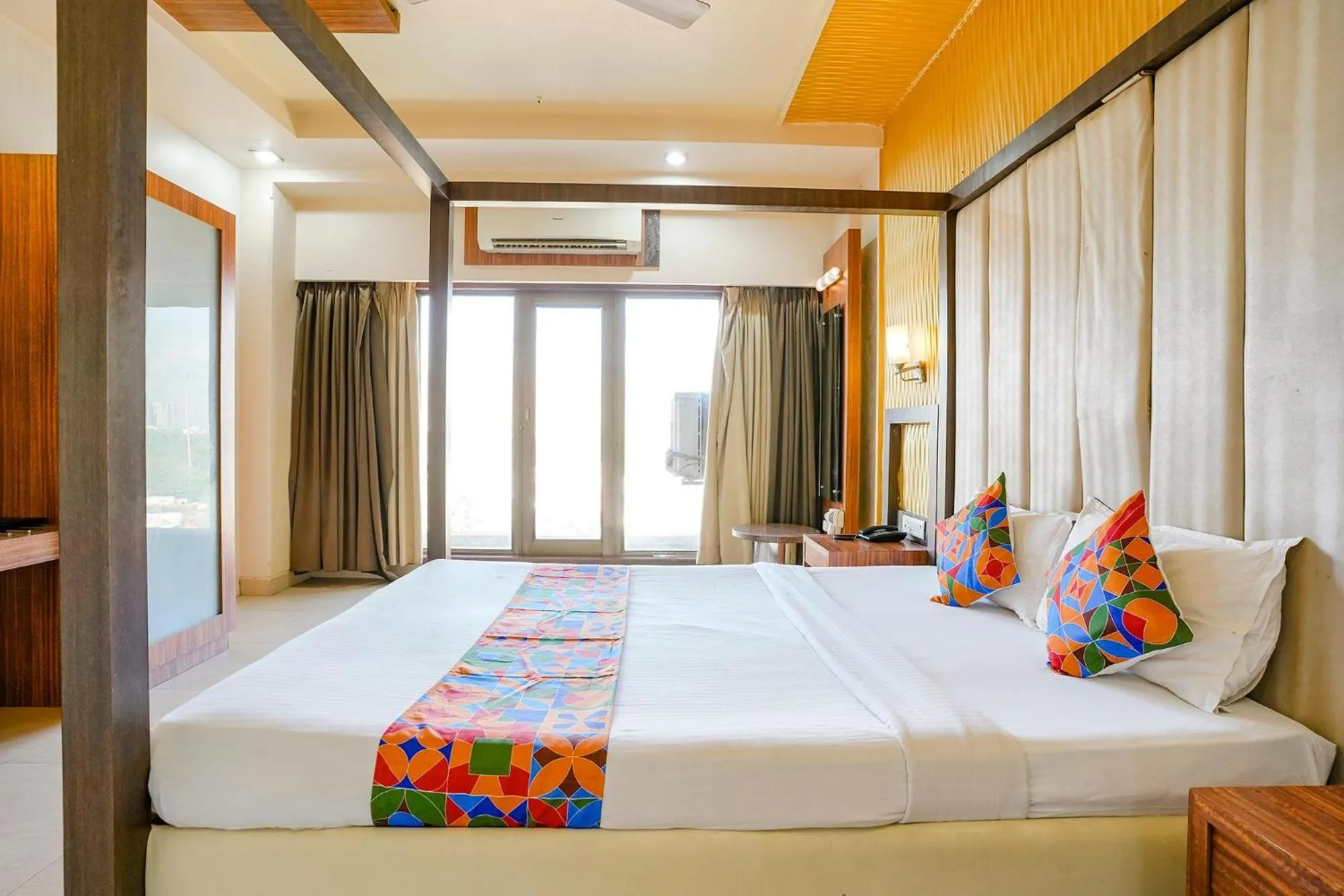 Bed in FabHotel Devanshi Inn