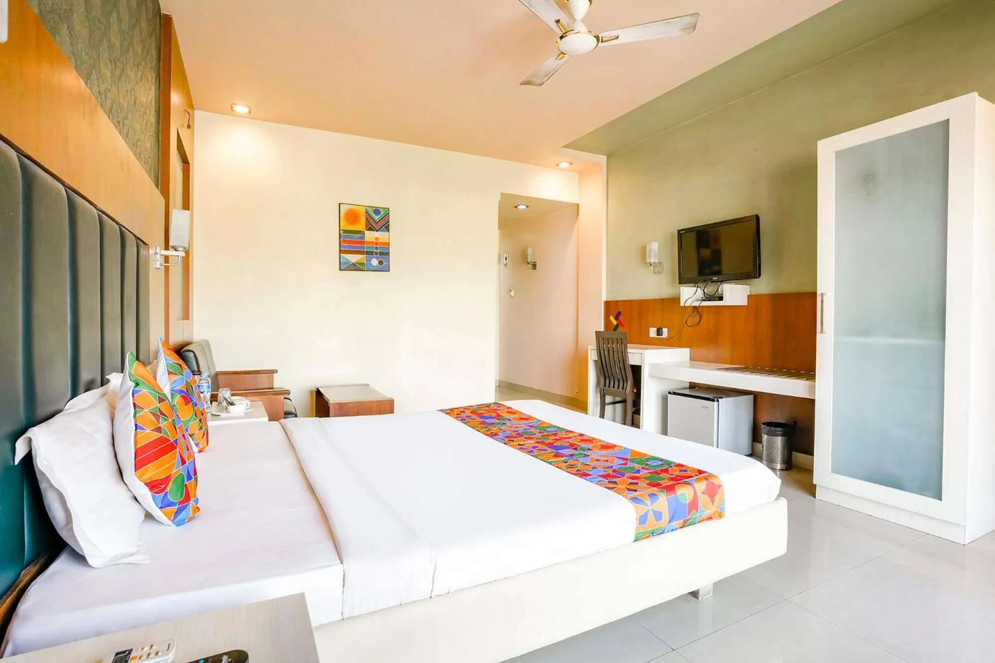 Bed in FabHotel Devanshi Inn