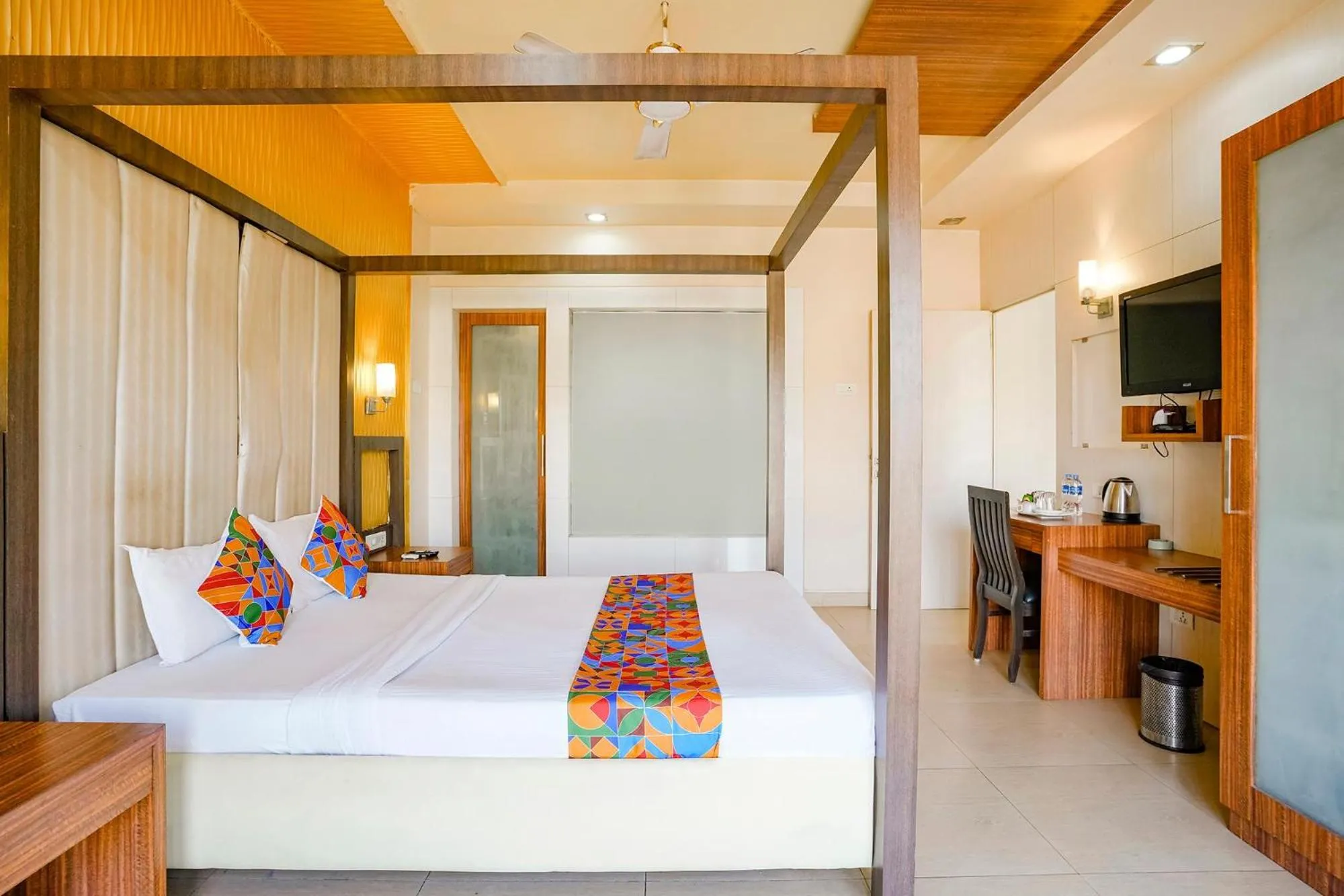 Bed in FabHotel Devanshi Inn