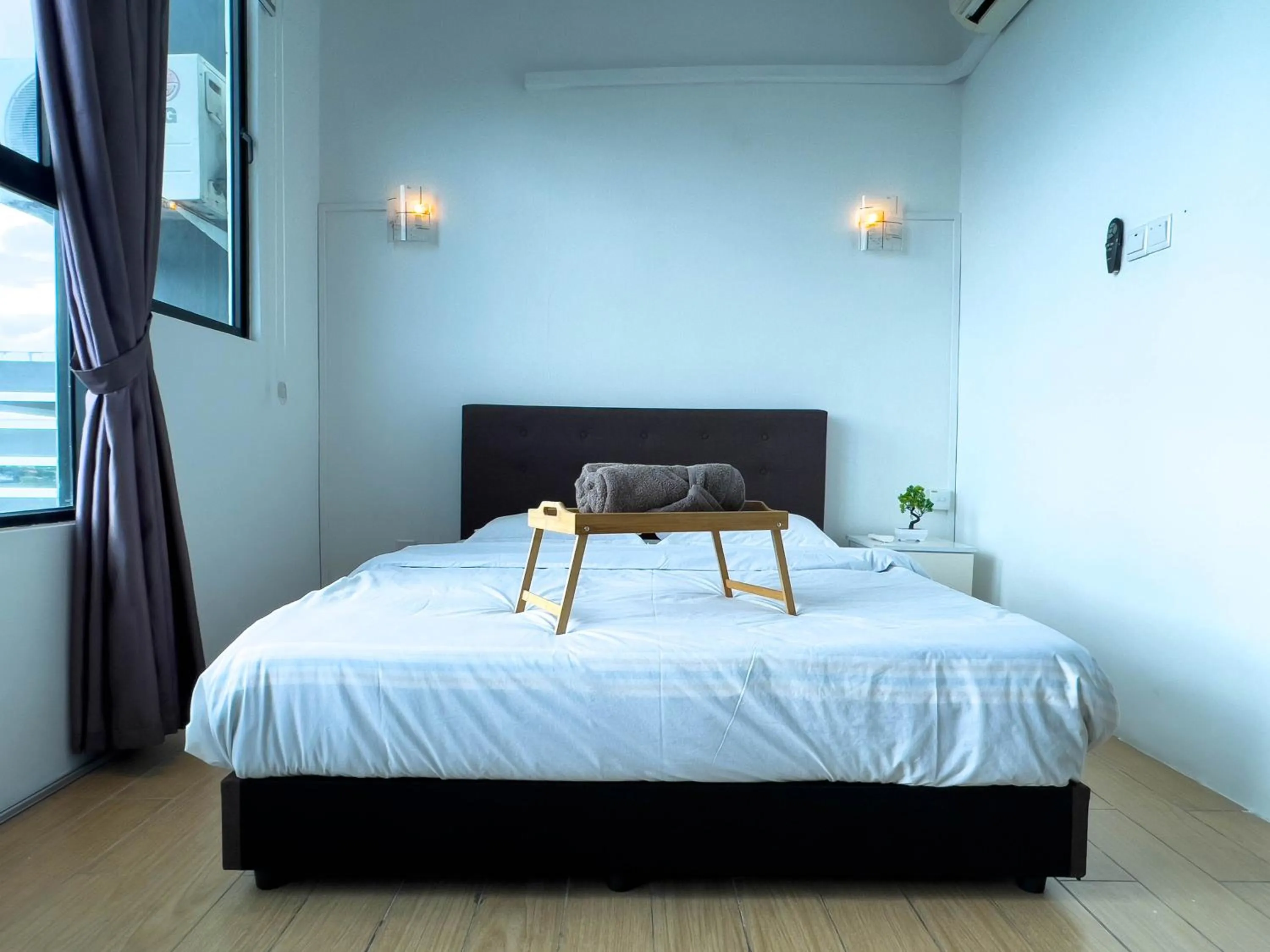 Bed in Hush Inn at ITCC Manhattan Suites