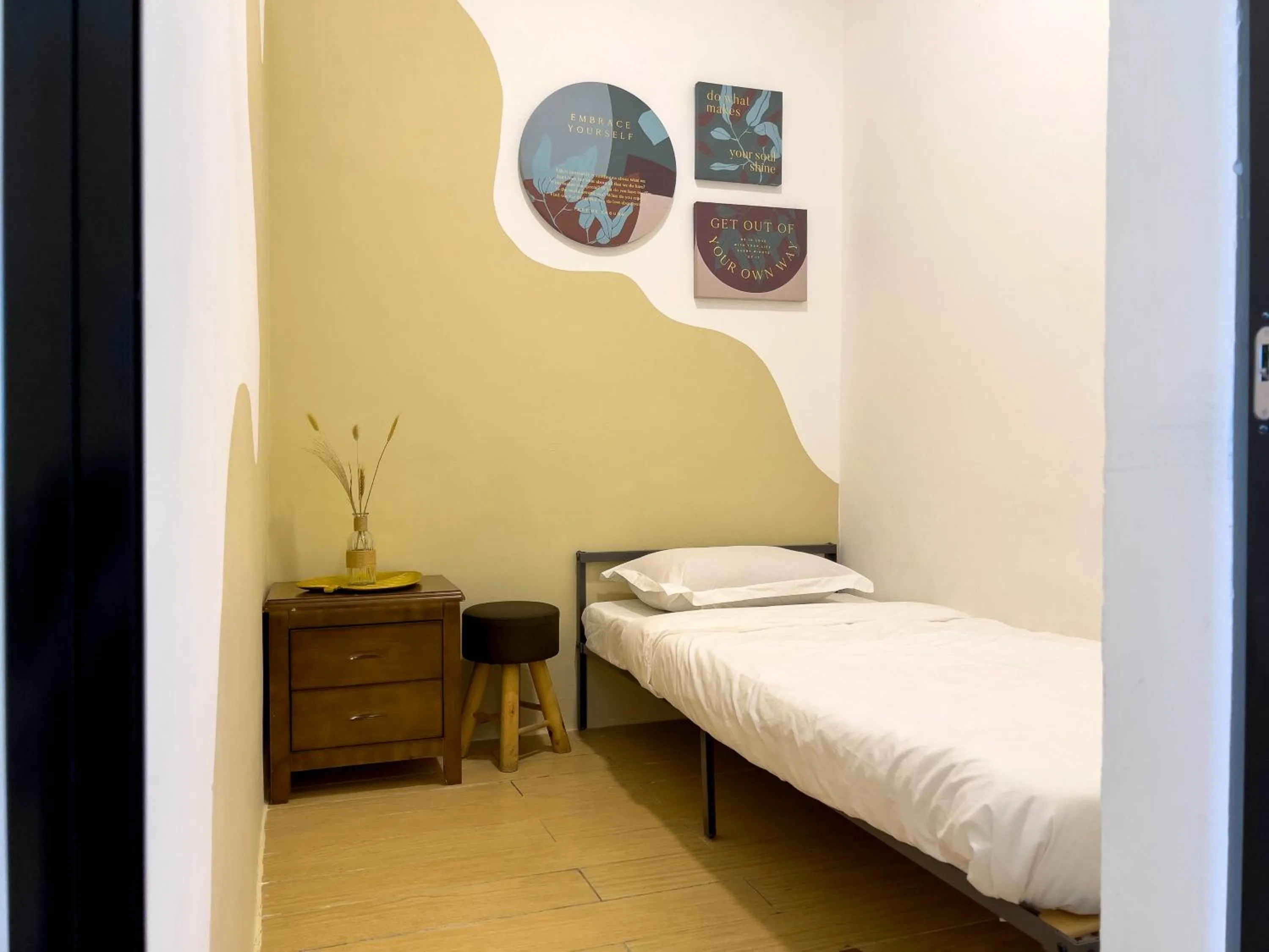 Bed in Hush Inn at ITCC Manhattan Suites