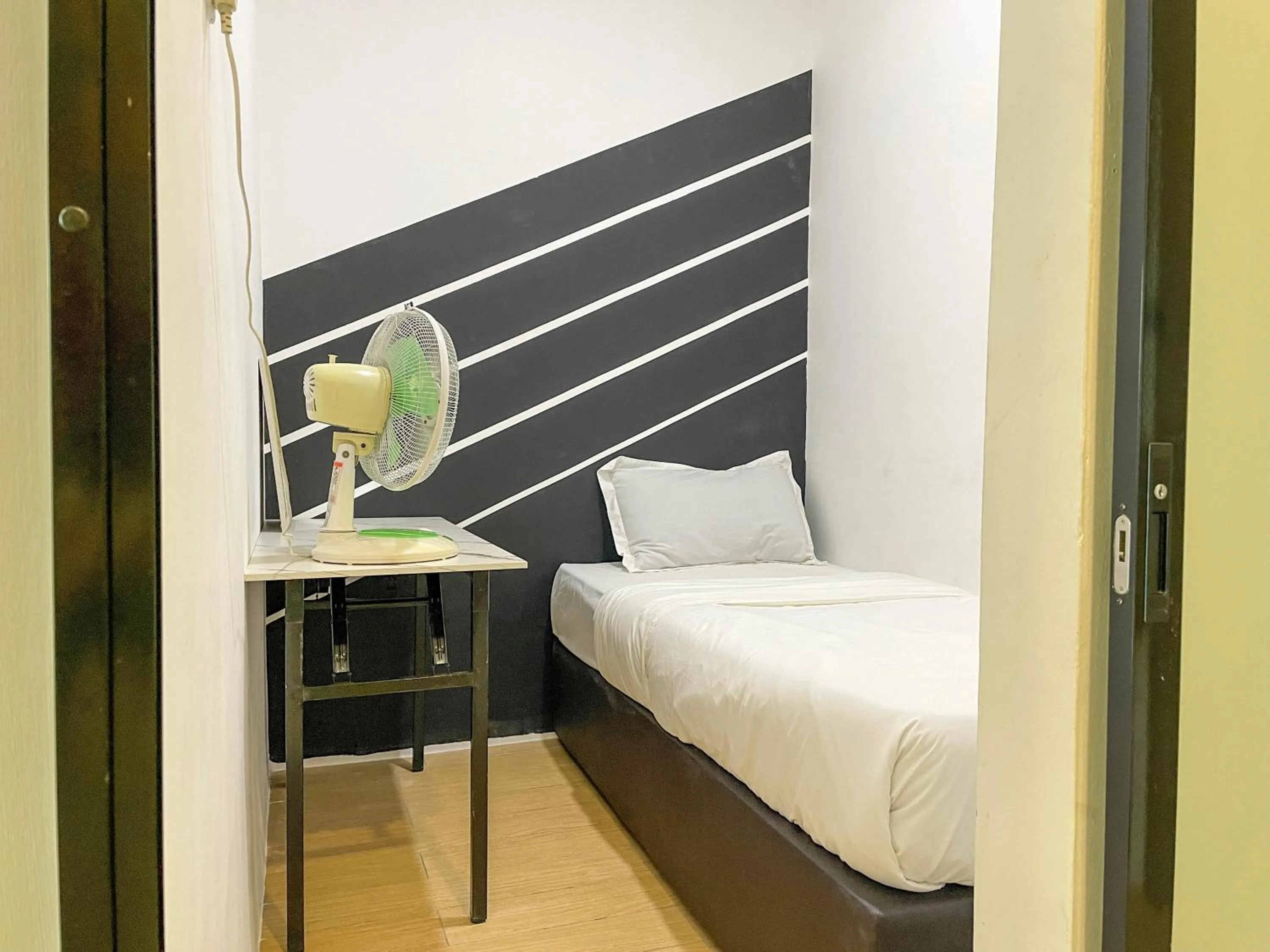 Bed in Hush Inn at ITCC Manhattan Suites