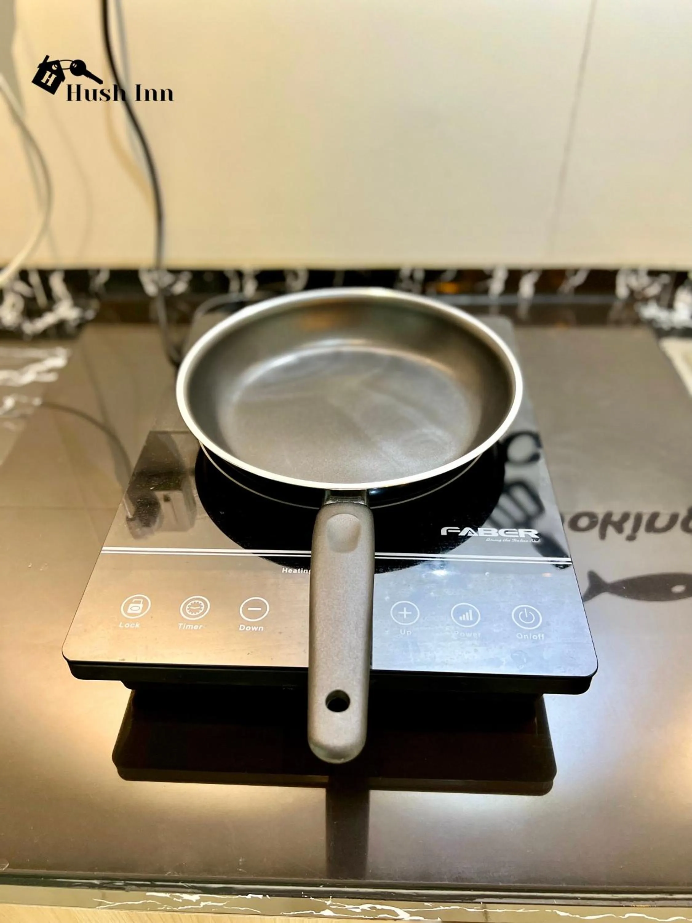 stove in Hush Inn at ITCC Manhattan Suites