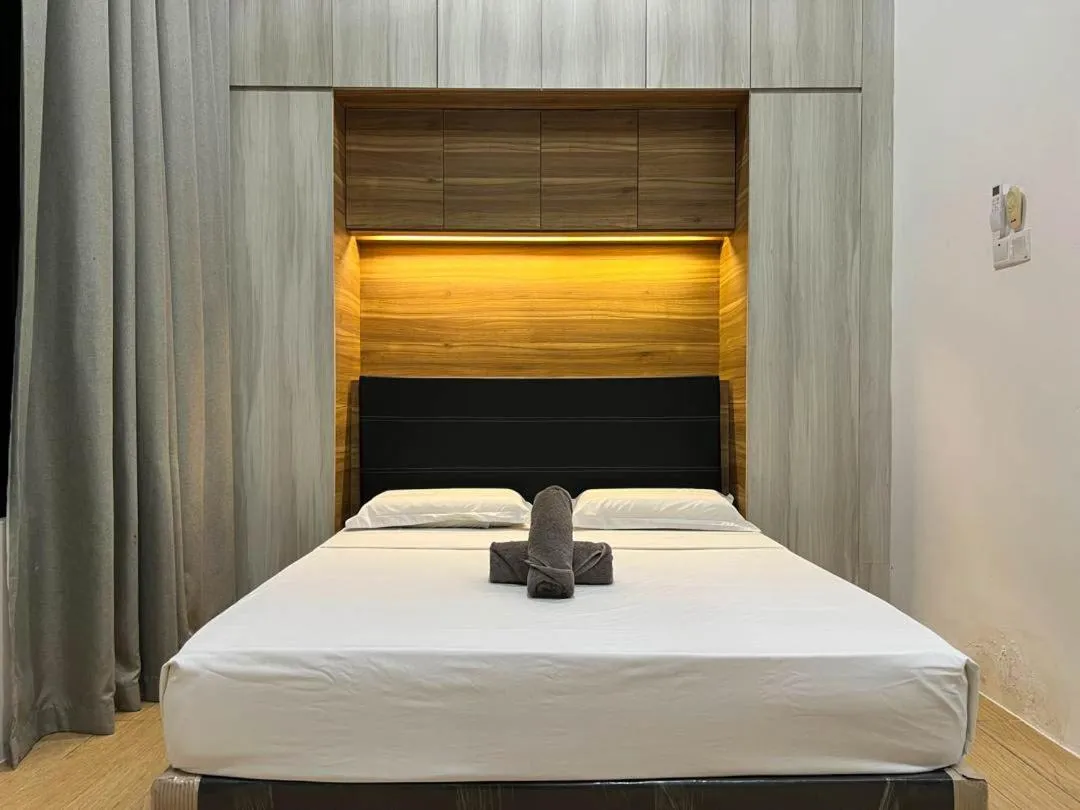 Bed in Hush Inn at ITCC Manhattan Suites