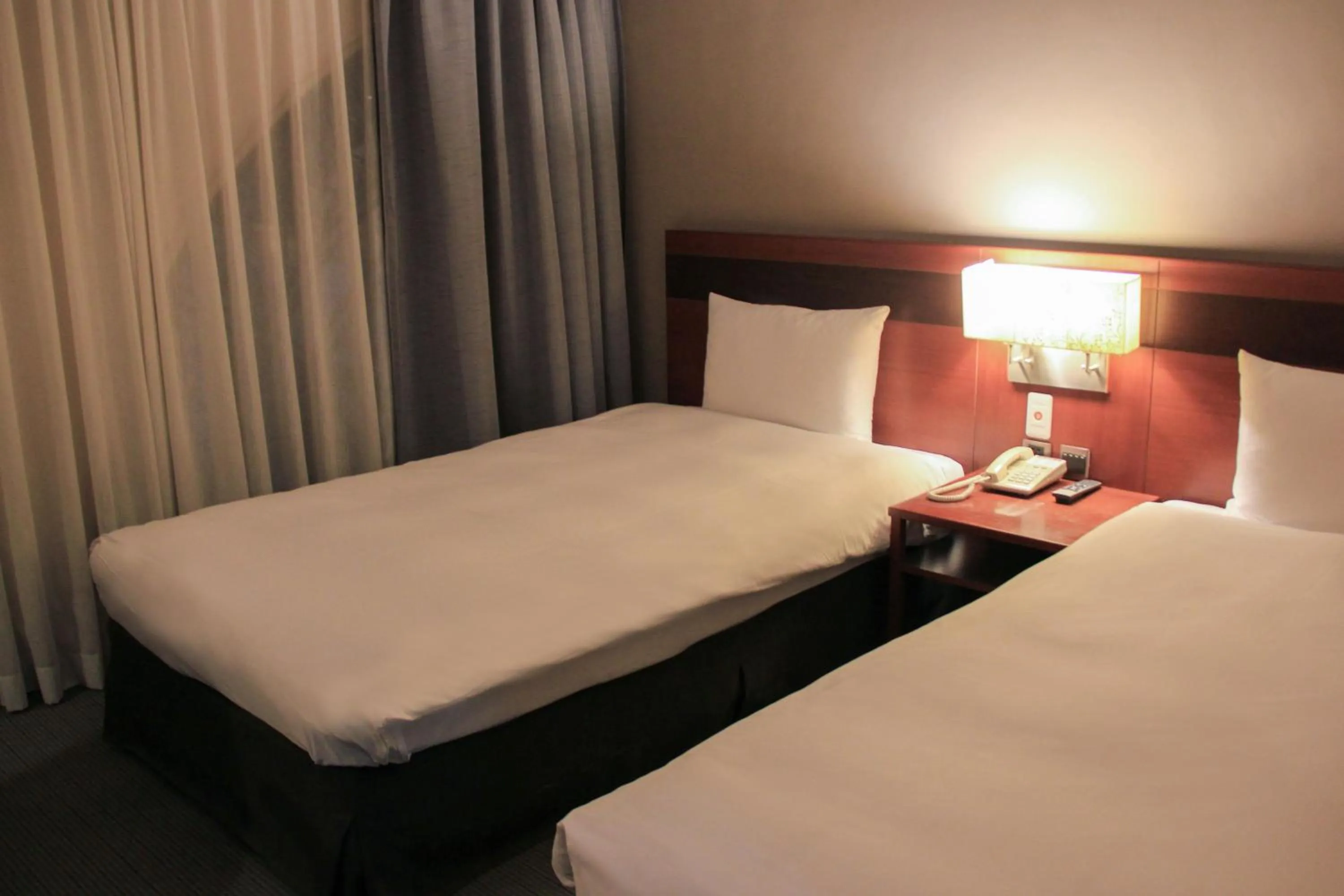 Bed in Guide Hotel Hsinchu Zhongyang