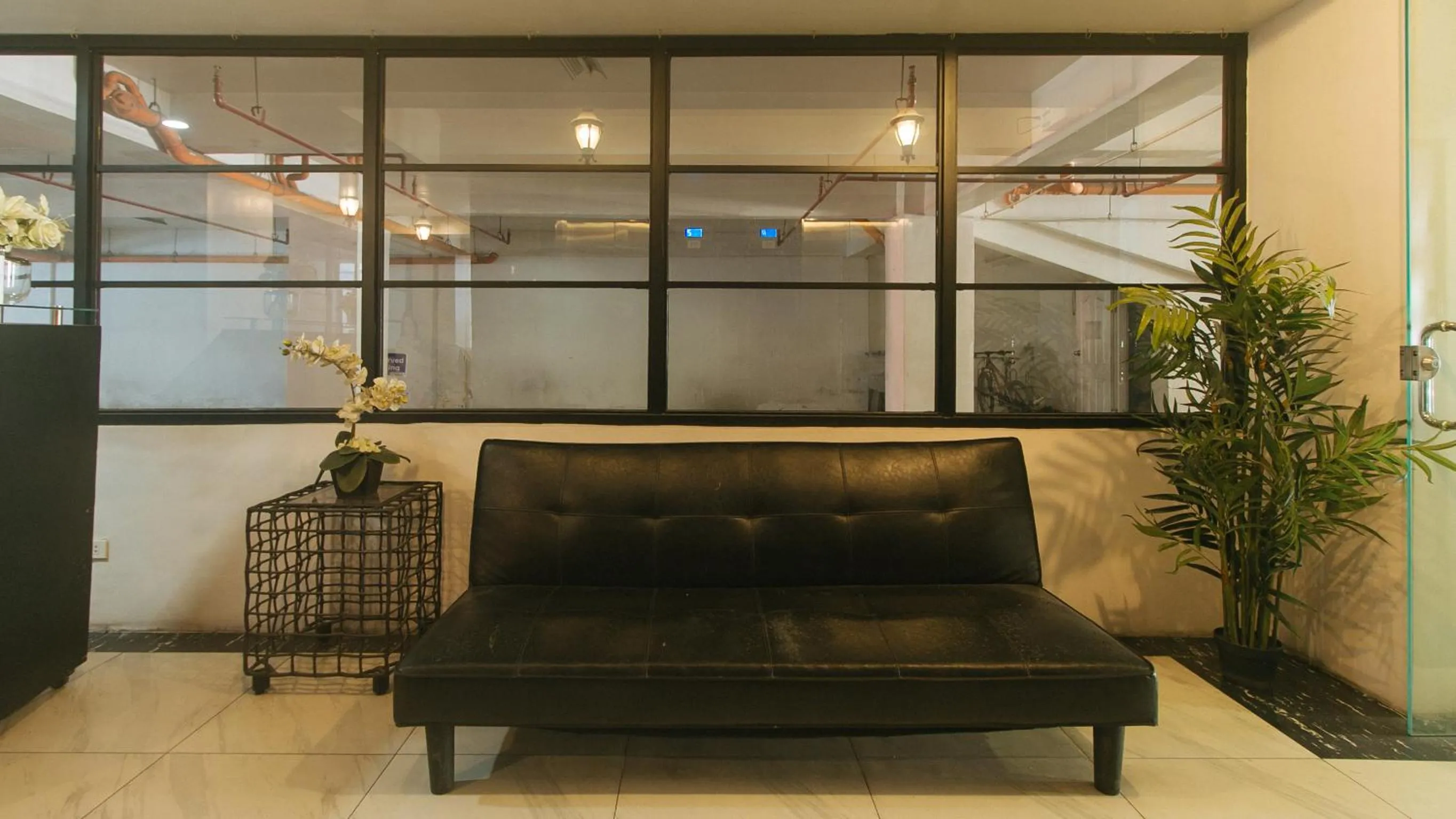 Seating area in 59 Xavierville by RedDoorz