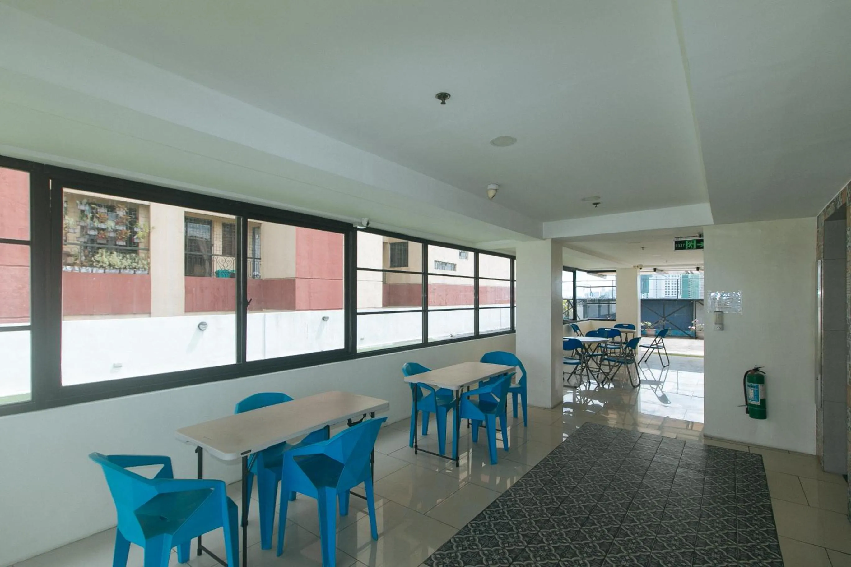 Seating area in 59 Xavierville by RedDoorz