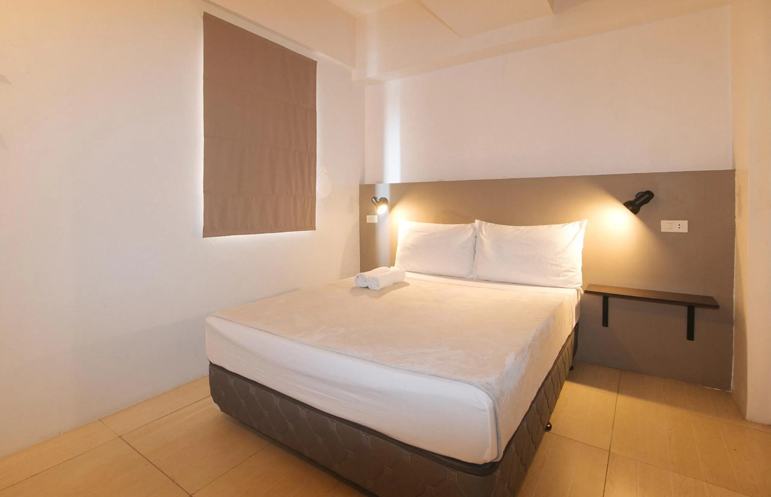 Bed in 59 Xavierville by RedDoorz