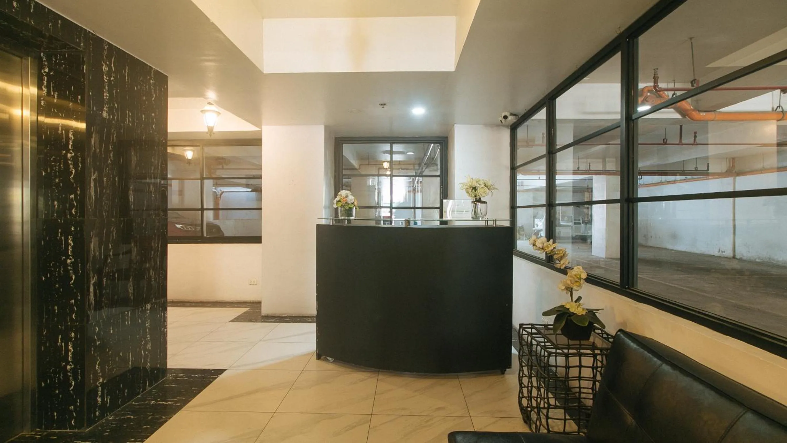 Seating area in 59 Xavierville by RedDoorz