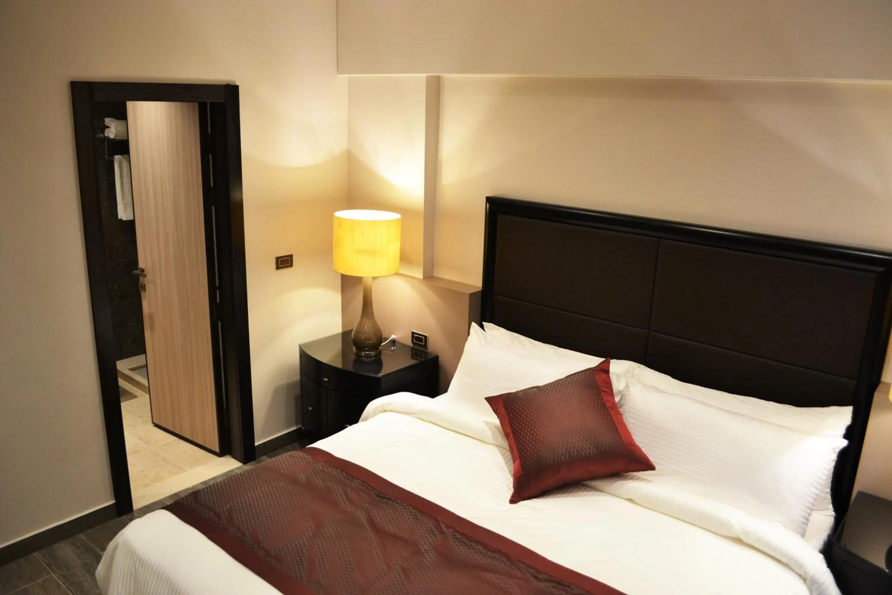 Bed in Ambassador, a Boutique Hotel