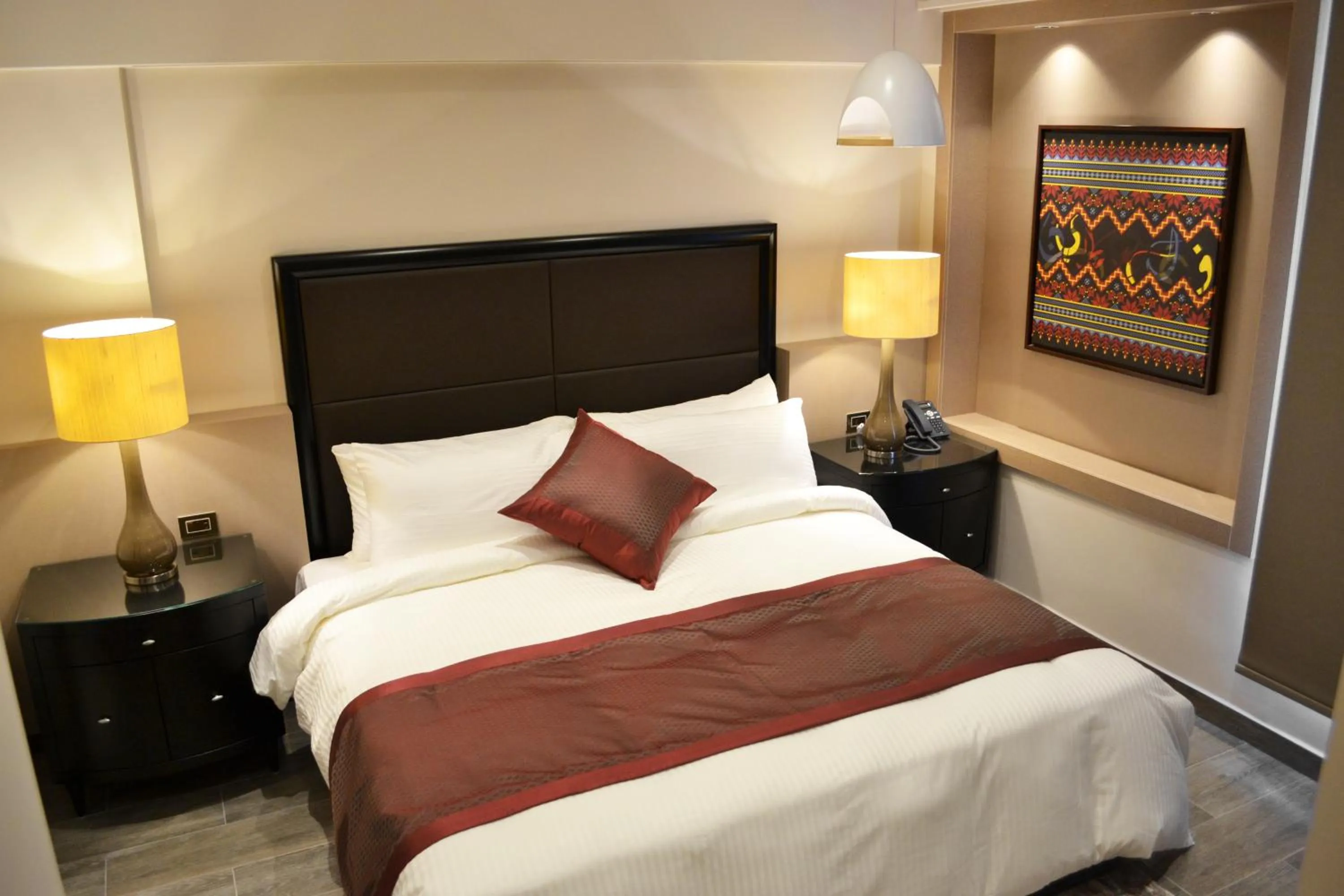 Bed in Ambassador, a Boutique Hotel