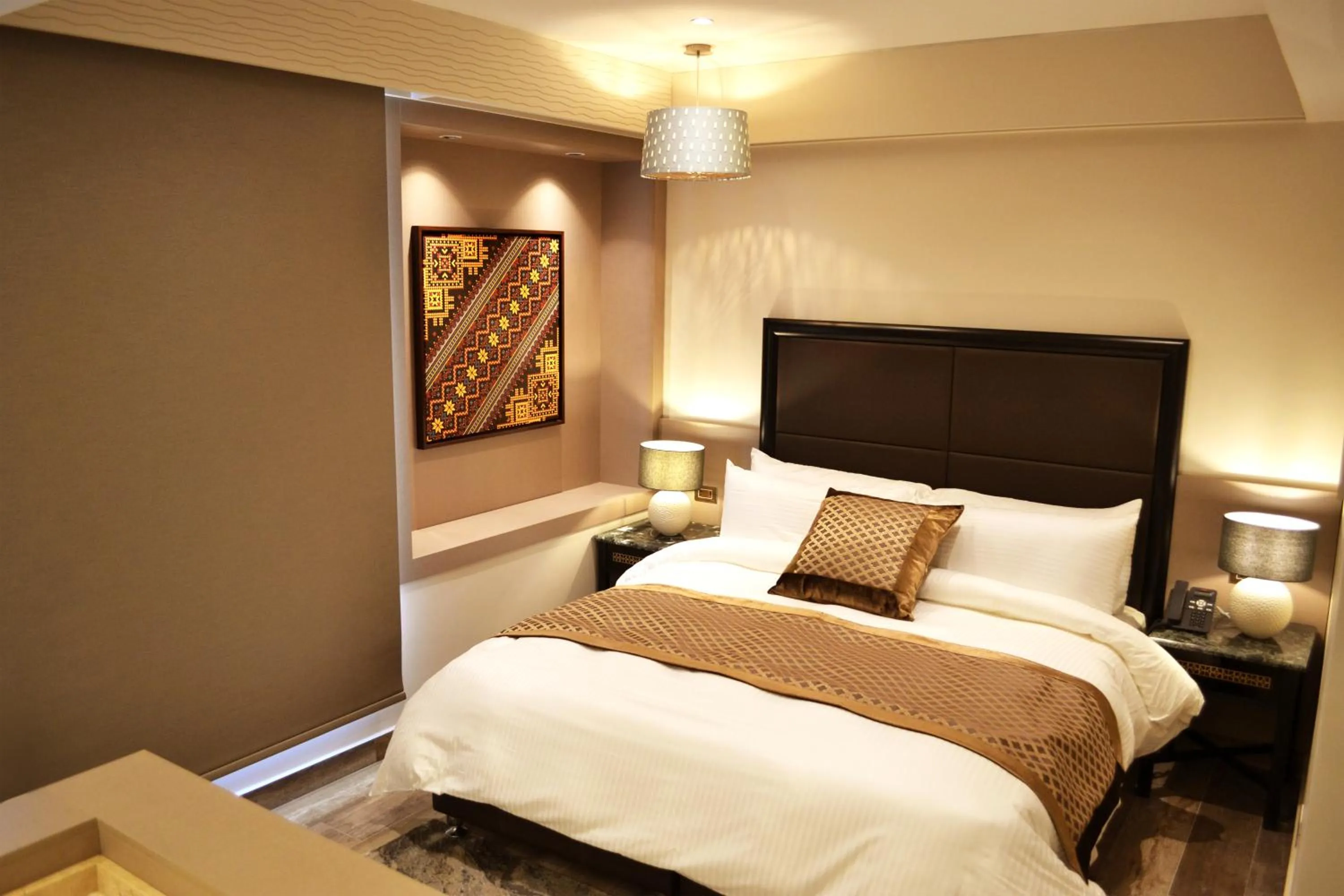 Bed in Ambassador, a Boutique Hotel